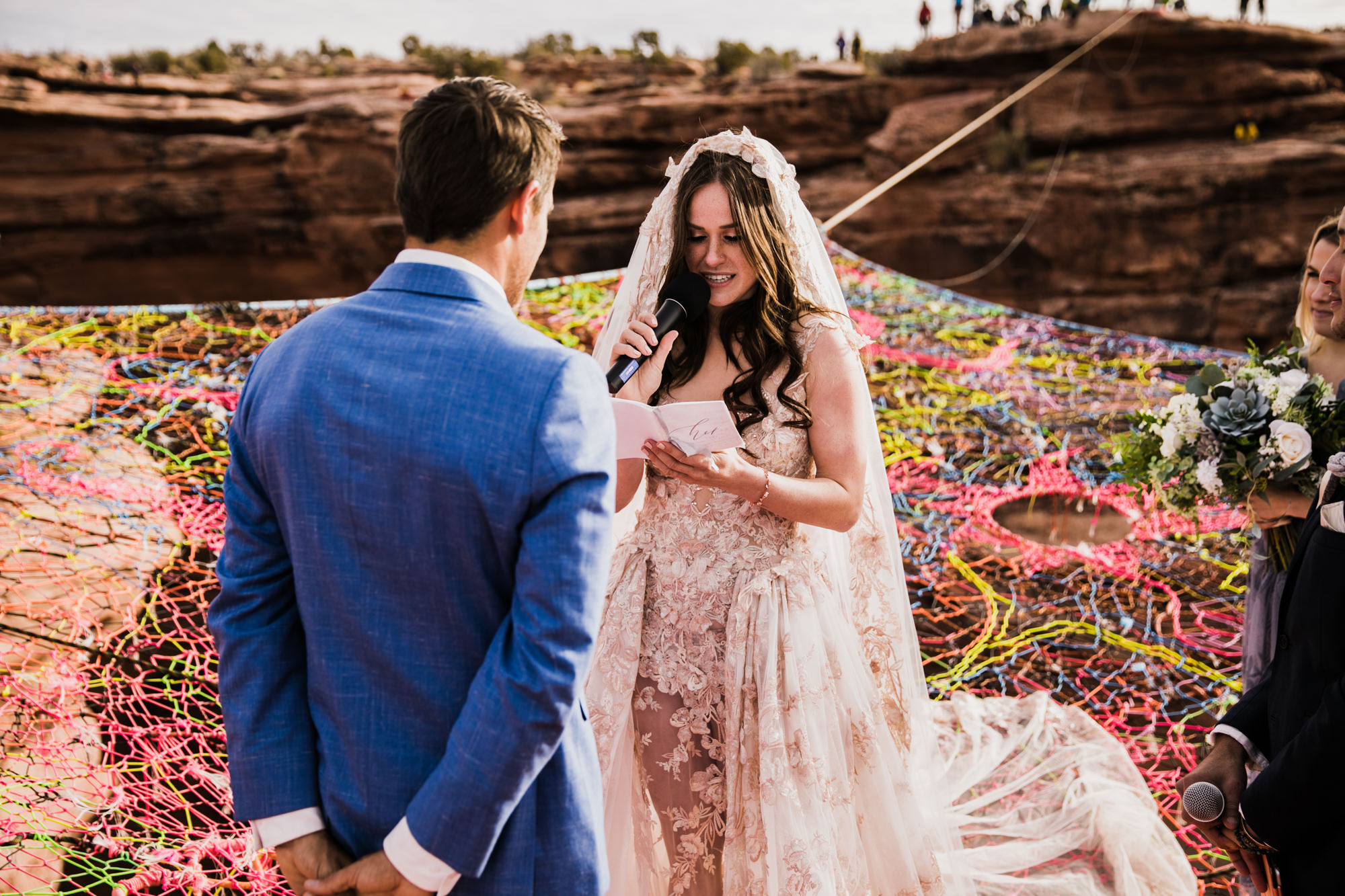 spacenet wedding 400 feet above a canyon in moab, utah | adventurous desert elopement | galia lahav bride | the hearnes adventure wedding photography | www.thehearnes.com