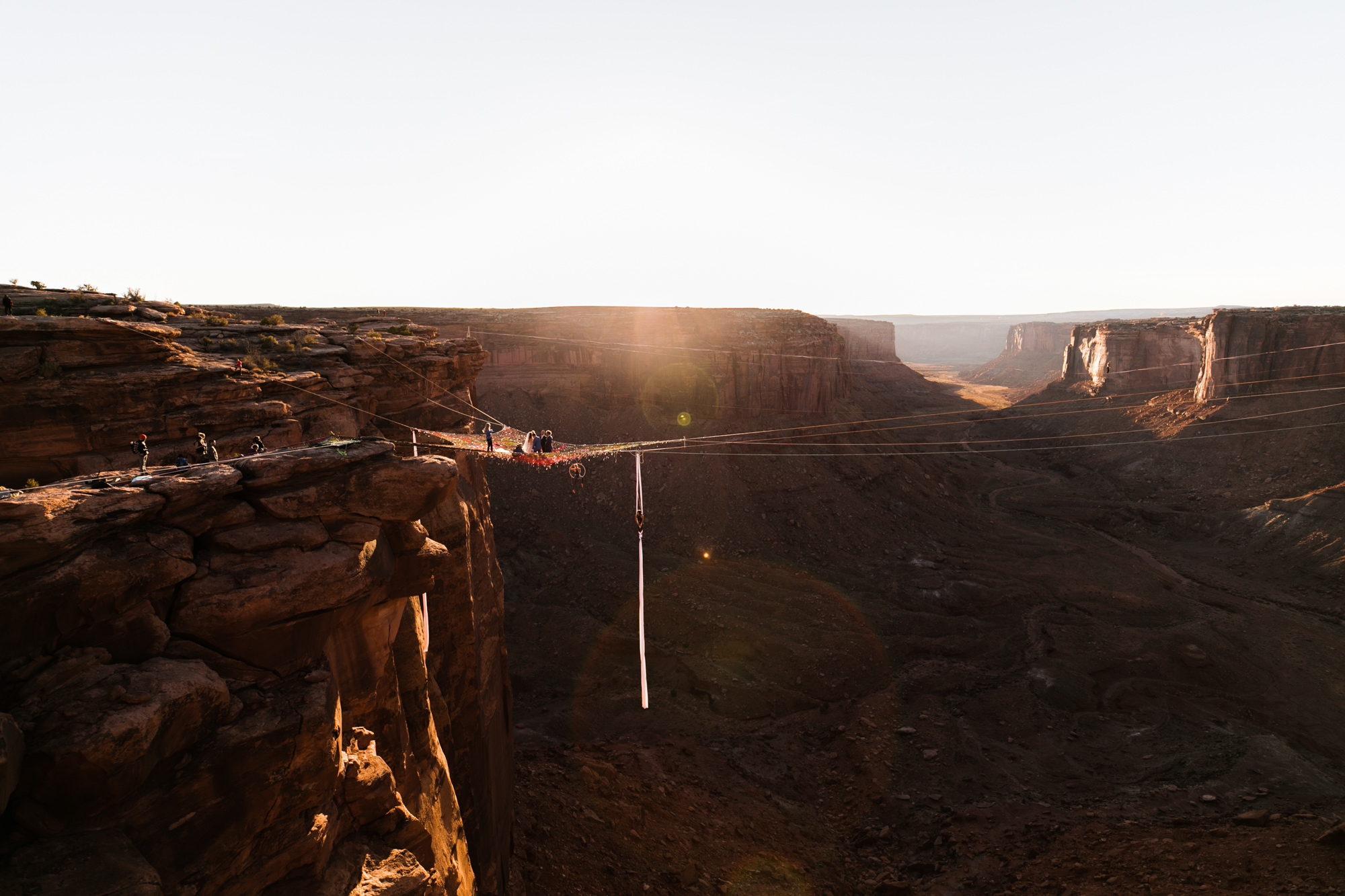 spacenet wedding 400 feet above a canyon in moab, utah | adventurous desert elopement | galia lahav bride | the hearnes adventure wedding photography | www.thehearnes.com