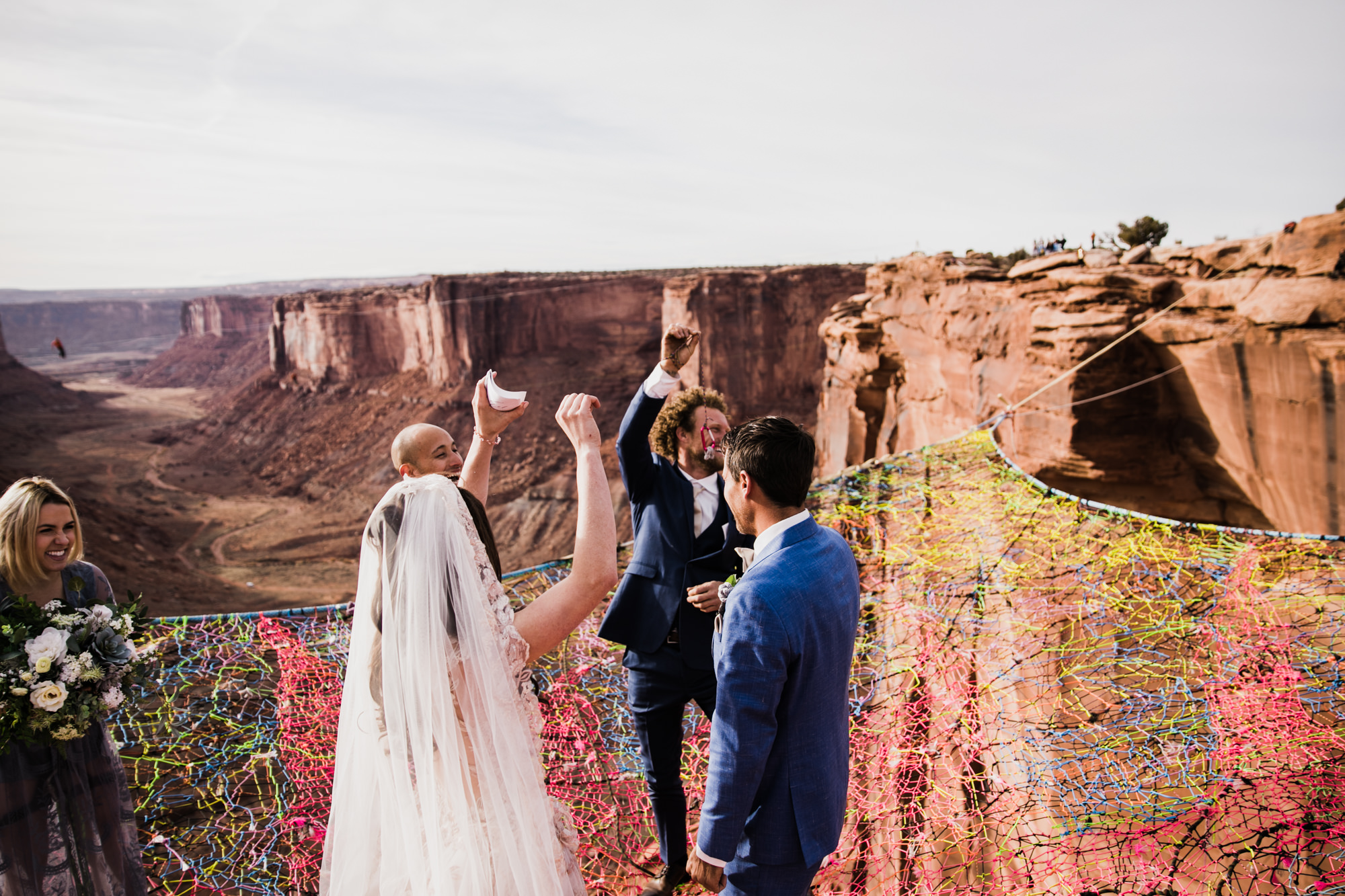 spacenet wedding 400 feet above a canyon in moab, utah | adventurous desert elopement | galia lahav bride | the hearnes adventure wedding photography | www.thehearnes.com