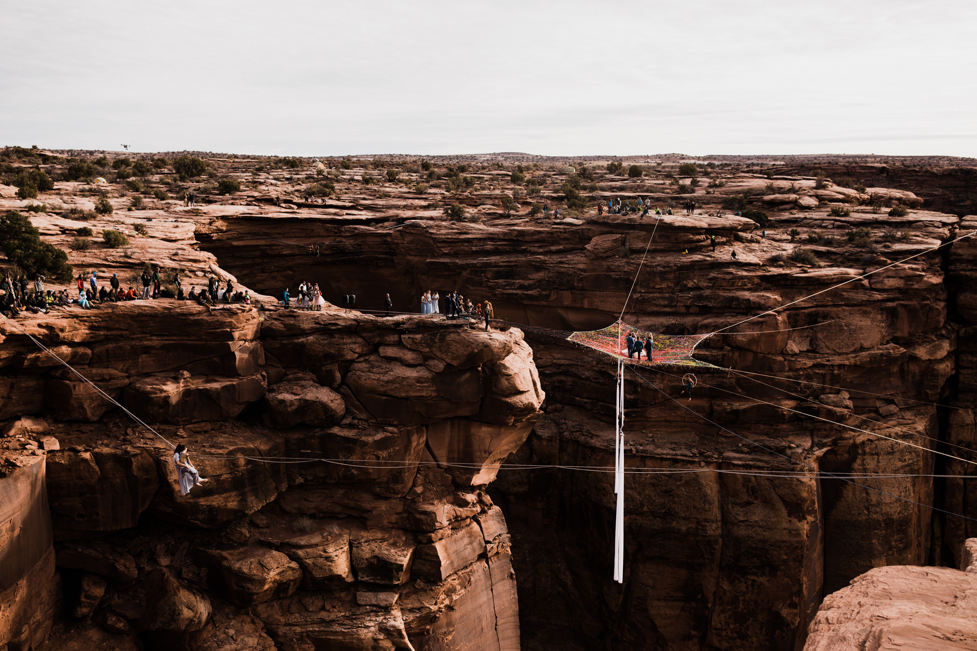 spacenet wedding 400 feet above a canyon in moab, utah | adventurous desert elopement | galia lahav bride | the hearnes adventure wedding photography | www.thehearnes.com