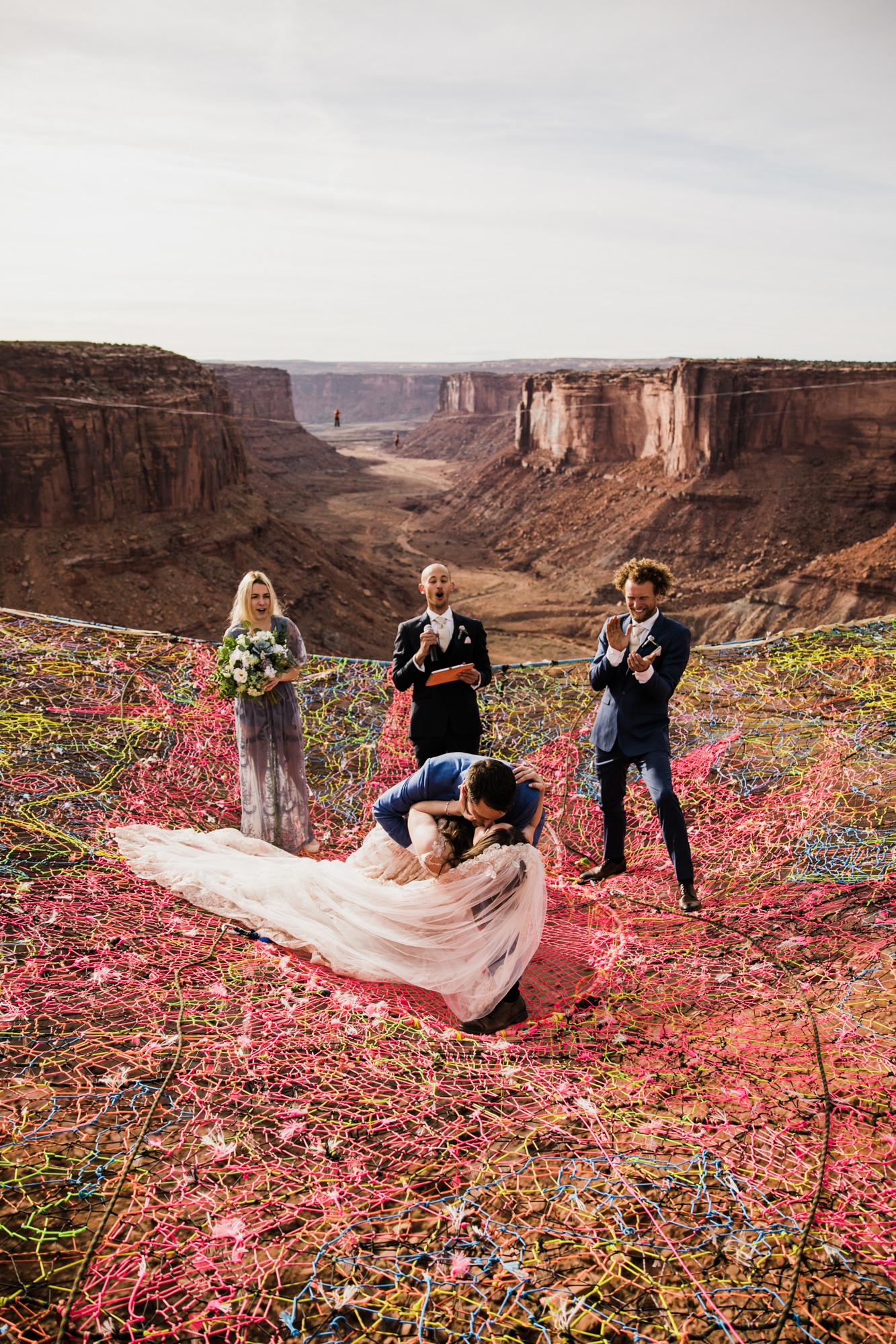 spacenet wedding 400 feet above a canyon in moab, utah | adventurous desert elopement | galia lahav bride | the hearnes adventure wedding photography | www.thehearnes.com