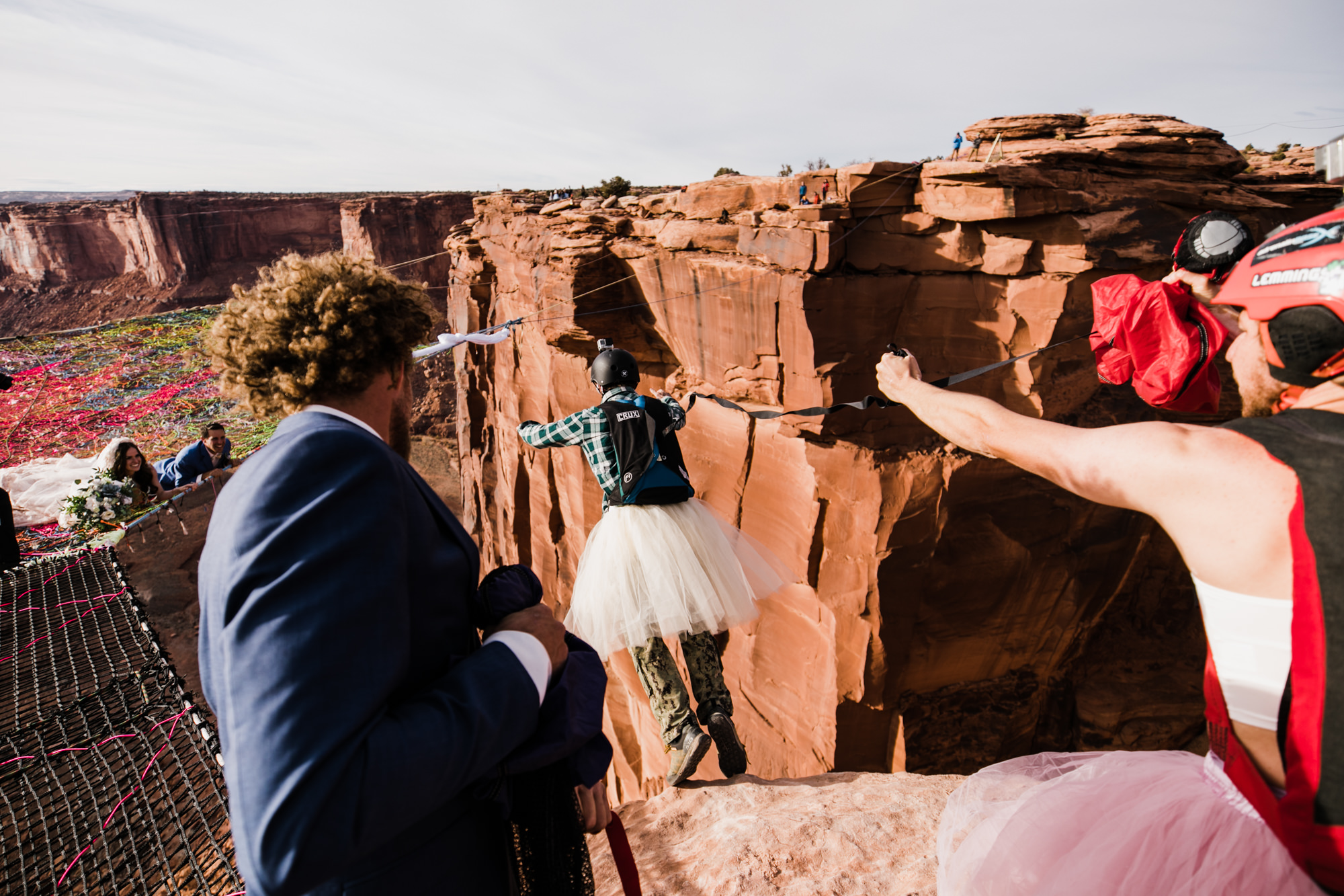 spacenet wedding 400 feet above a canyon in moab, utah | adventurous desert elopement | galia lahav bride | the hearnes adventure wedding photography | www.thehearnes.com