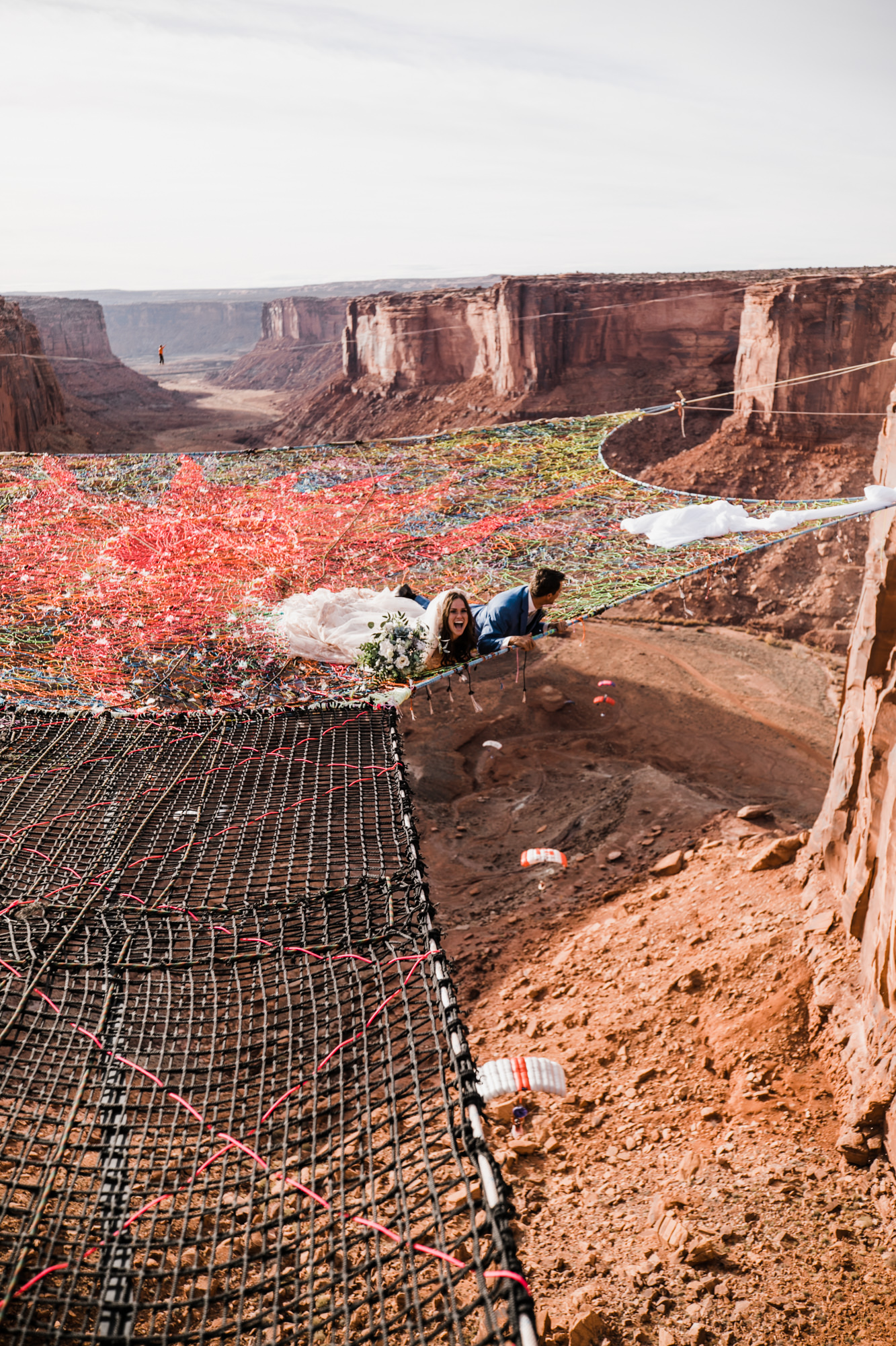 spacenet wedding 400 feet above a canyon in moab, utah | adventurous desert elopement | galia lahav bride | the hearnes adventure wedding photography | www.thehearnes.com