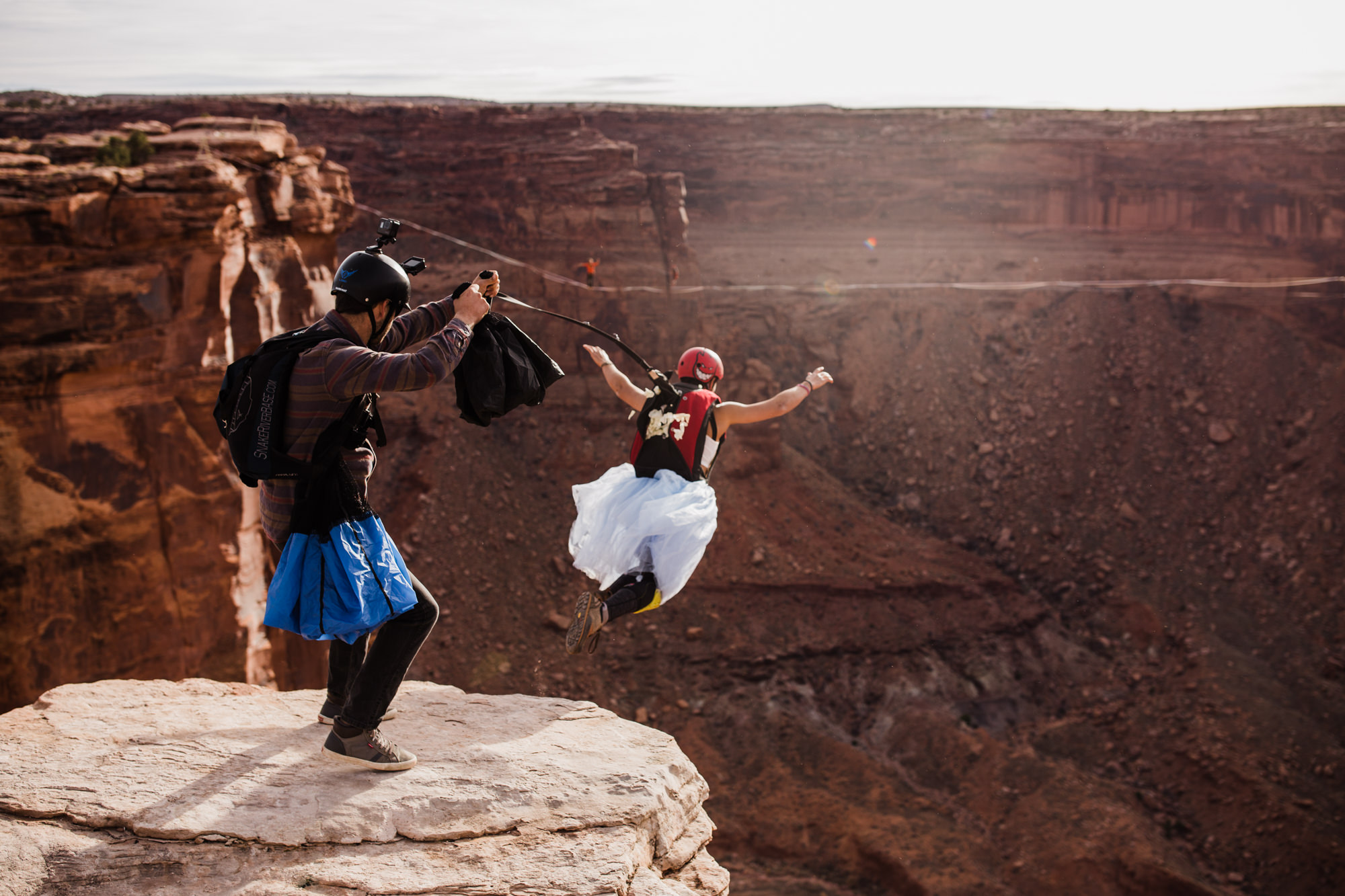 spacenet wedding 400 feet above a canyon in moab, utah | adventurous desert elopement | galia lahav bride | the hearnes adventure wedding photography | www.thehearnes.com