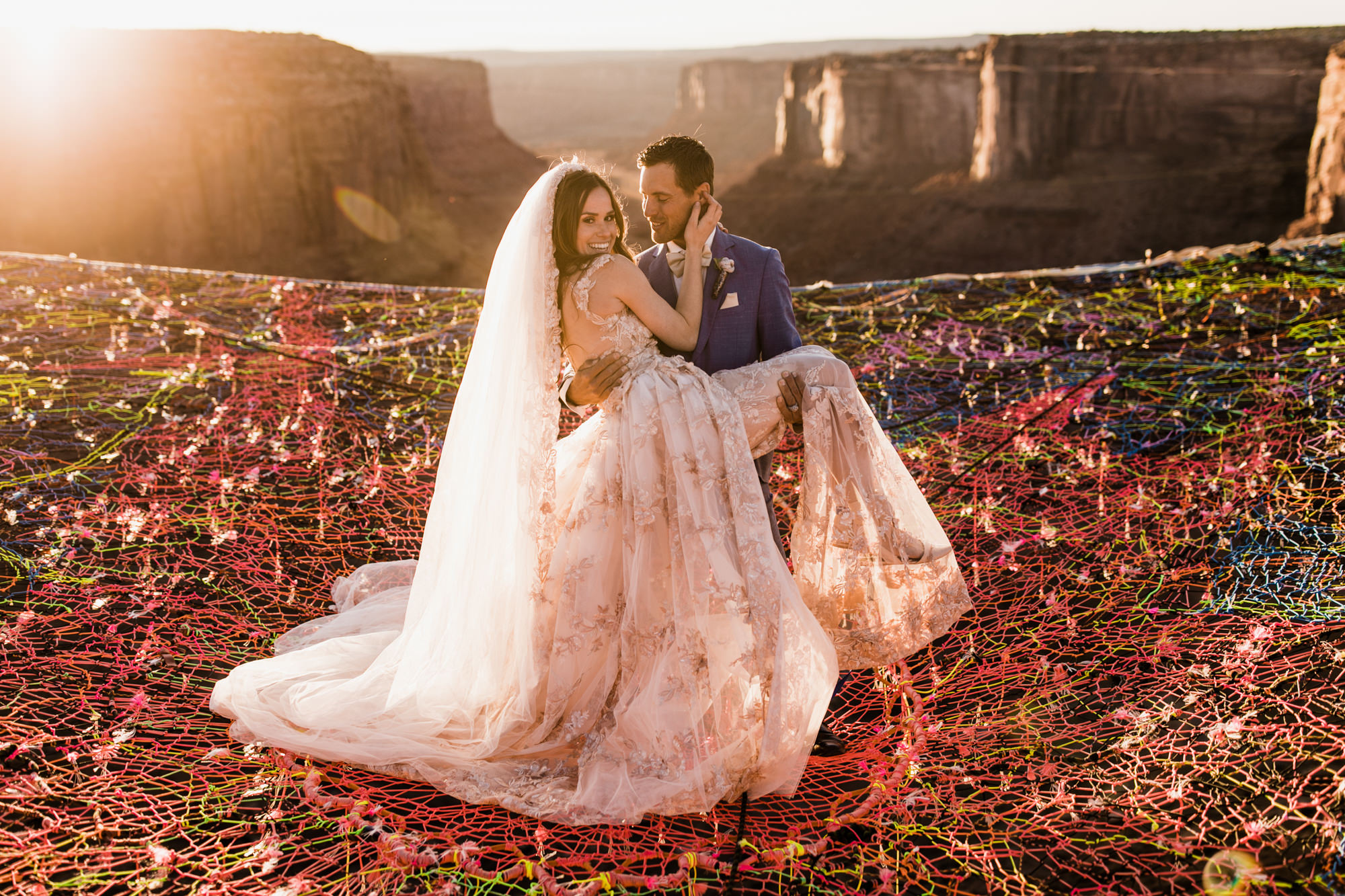 spacenet wedding 400 feet above a canyon in moab, utah | adventurous desert elopement | galia lahav bride | the hearnes adventure wedding photography | www.thehearnes.com