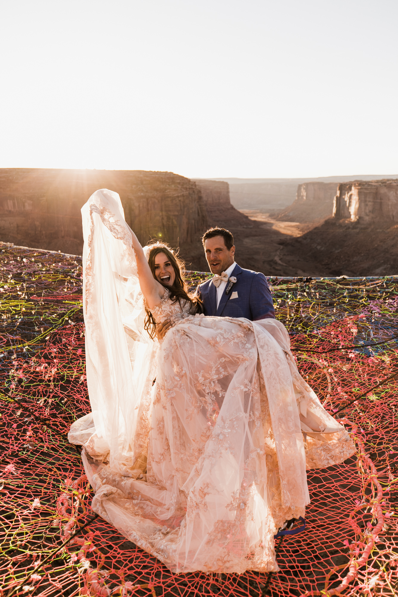 spacenet wedding 400 feet above a canyon in moab, utah | adventurous desert elopement | galia lahav bride | the hearnes adventure wedding photography | www.thehearnes.com