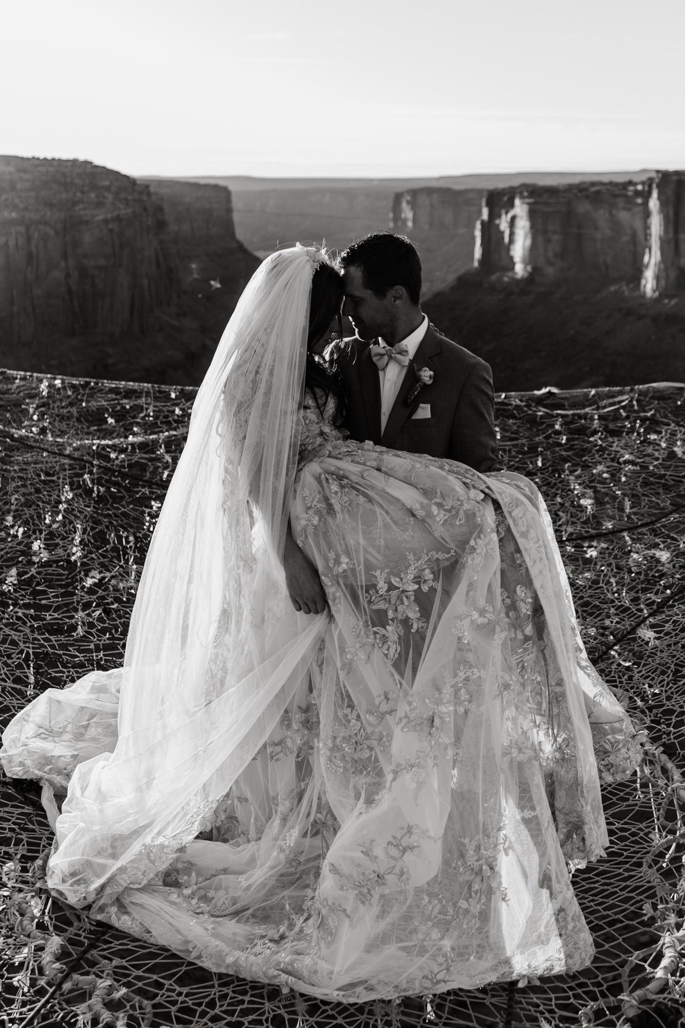 spacenet wedding 400 feet above a canyon in moab, utah | adventurous desert elopement | galia lahav bride | the hearnes adventure wedding photography | www.thehearnes.com