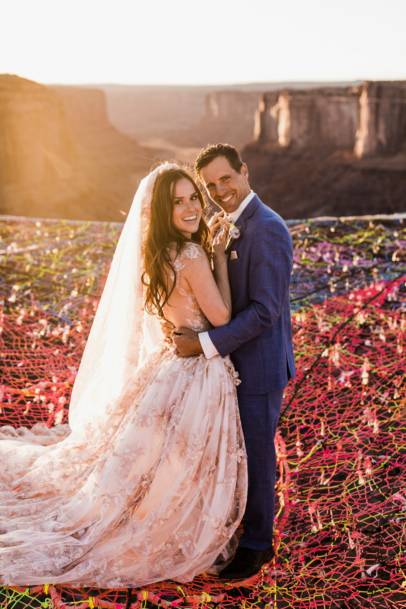 spacenet wedding 400 feet above a canyon in moab, utah | adventurous desert elopement | galia lahav bride | the hearnes adventure wedding photography | www.thehearnes.com