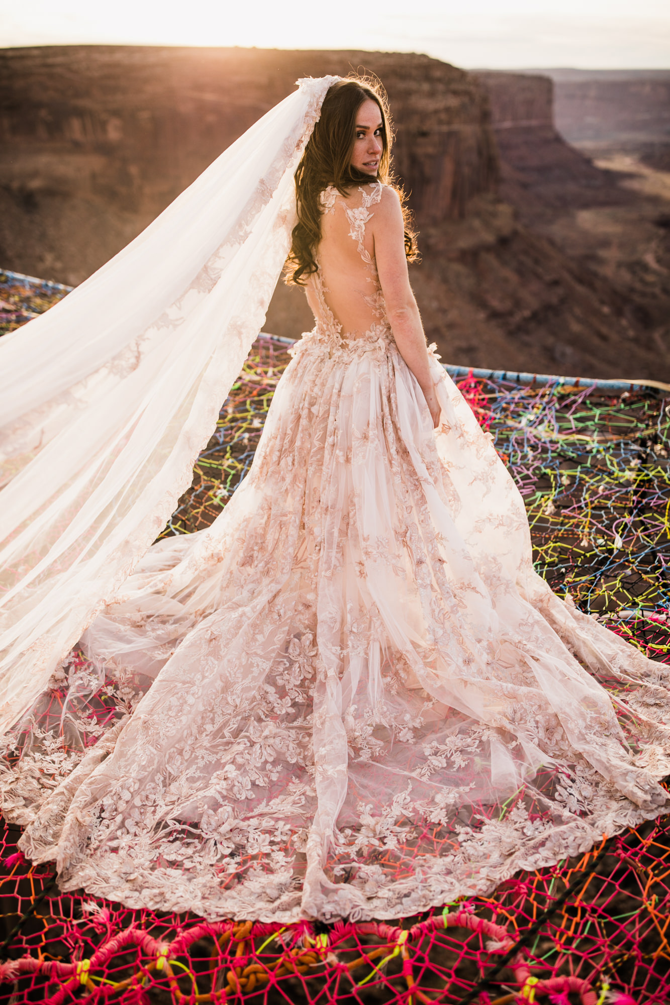 spacenet wedding 400 feet above a canyon in moab, utah | adventurous desert elopement | galia lahav bride | the hearnes adventure wedding photography | www.thehearnes.com