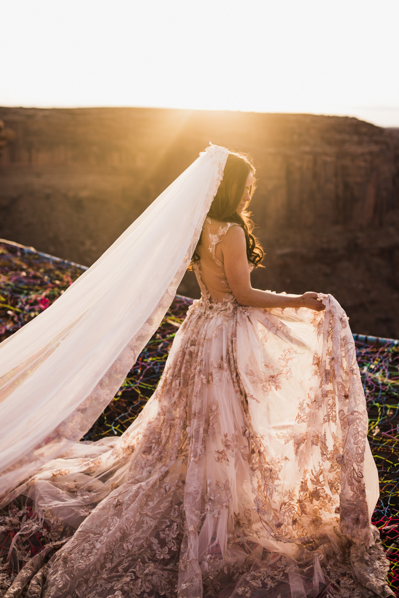 spacenet wedding 400 feet above a canyon in moab, utah | adventurous desert elopement | galia lahav bride | the hearnes adventure wedding photography | www.thehearnes.com