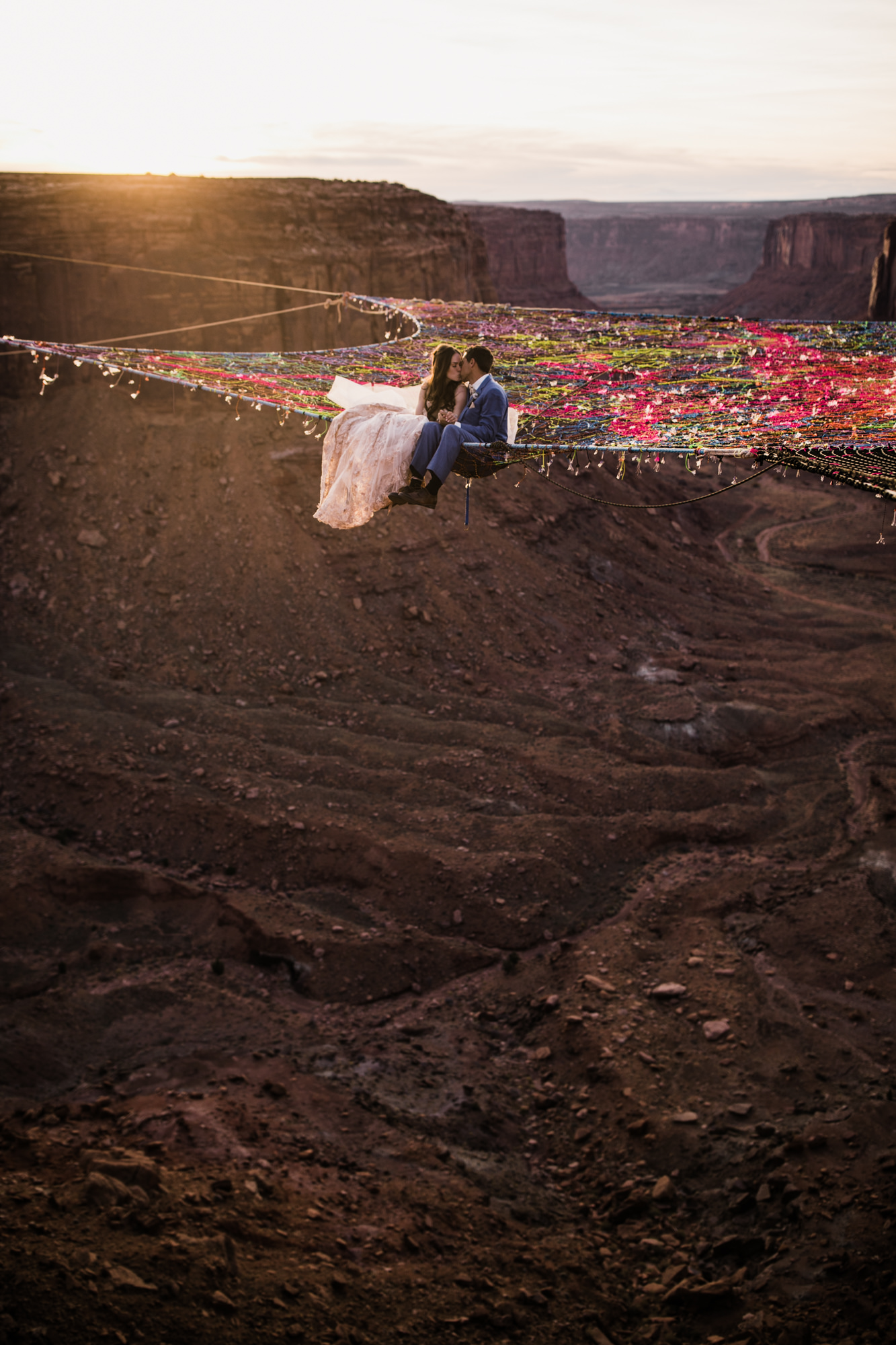 spacenet wedding 400 feet above a canyon in moab, utah | adventurous desert elopement | galia lahav bride | the hearnes adventure wedding photography | www.thehearnes.com