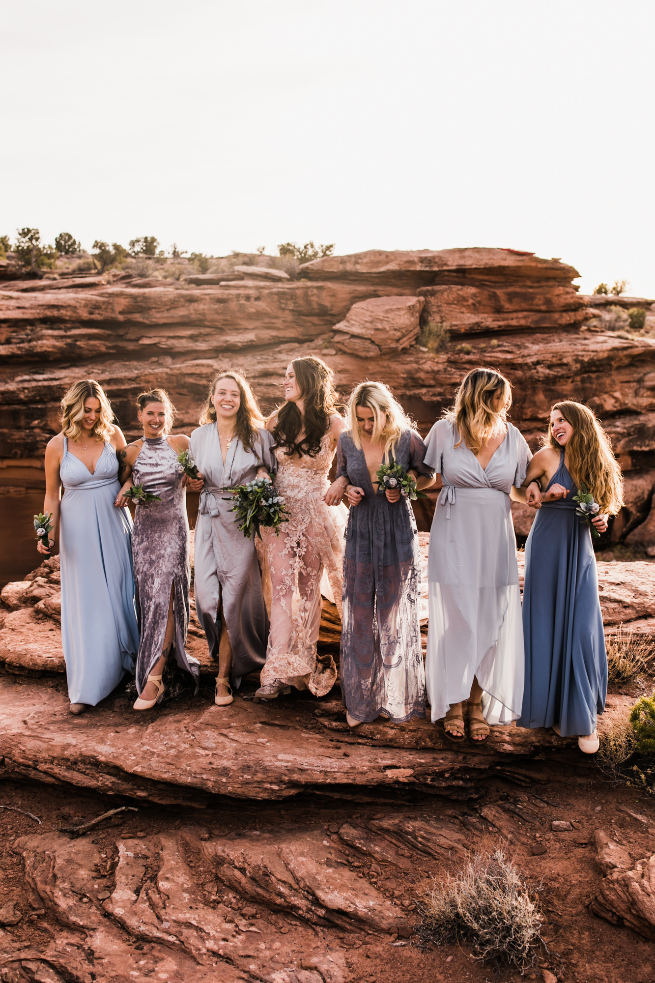 spacenet wedding 400 feet above a canyon in moab, utah | adventurous desert elopement | galia lahav bride | the hearnes adventure wedding photography | www.thehearnes.com