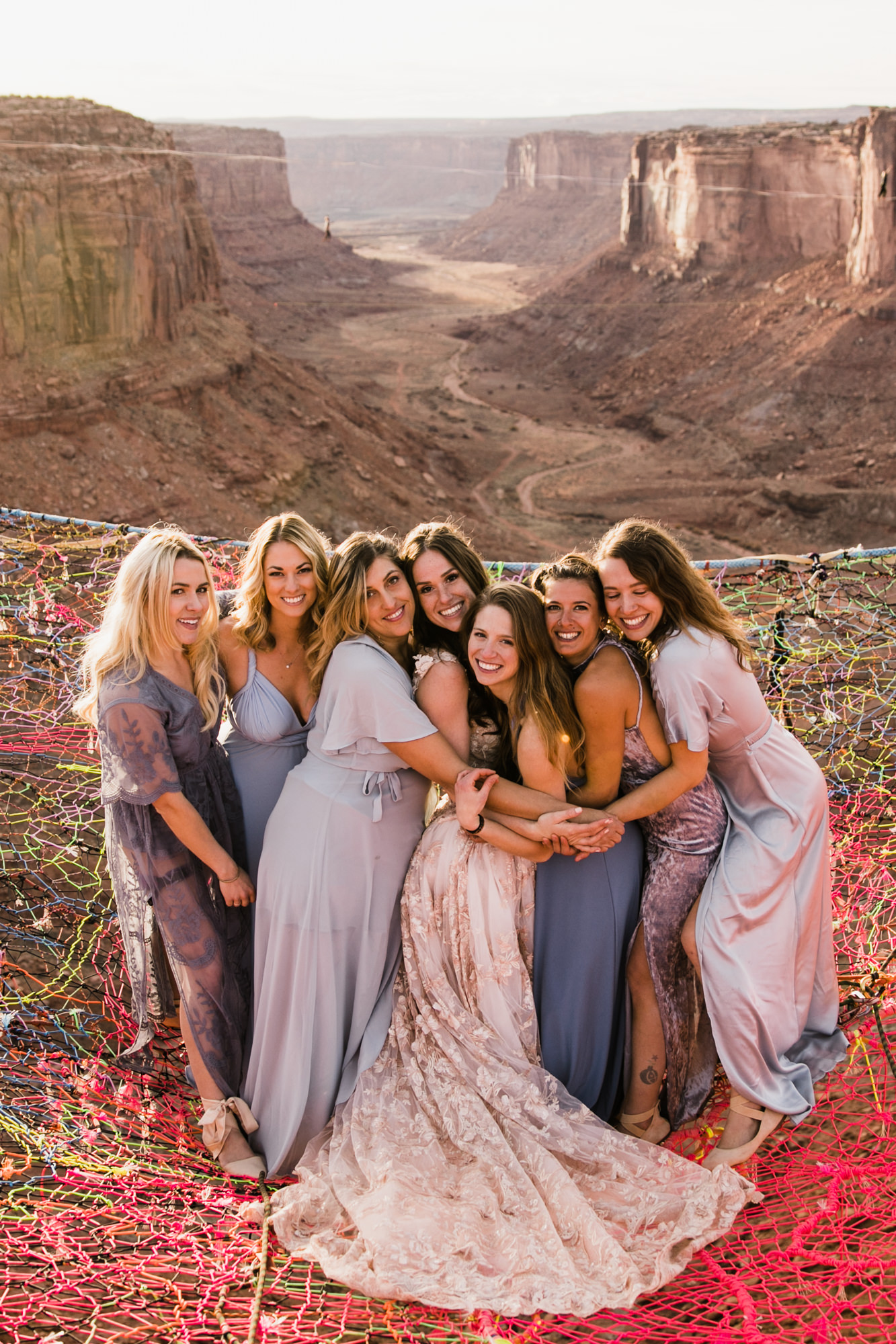 spacenet wedding 400 feet above a canyon in moab, utah | adventurous desert elopement | galia lahav bride | the hearnes adventure wedding photography | www.thehearnes.com