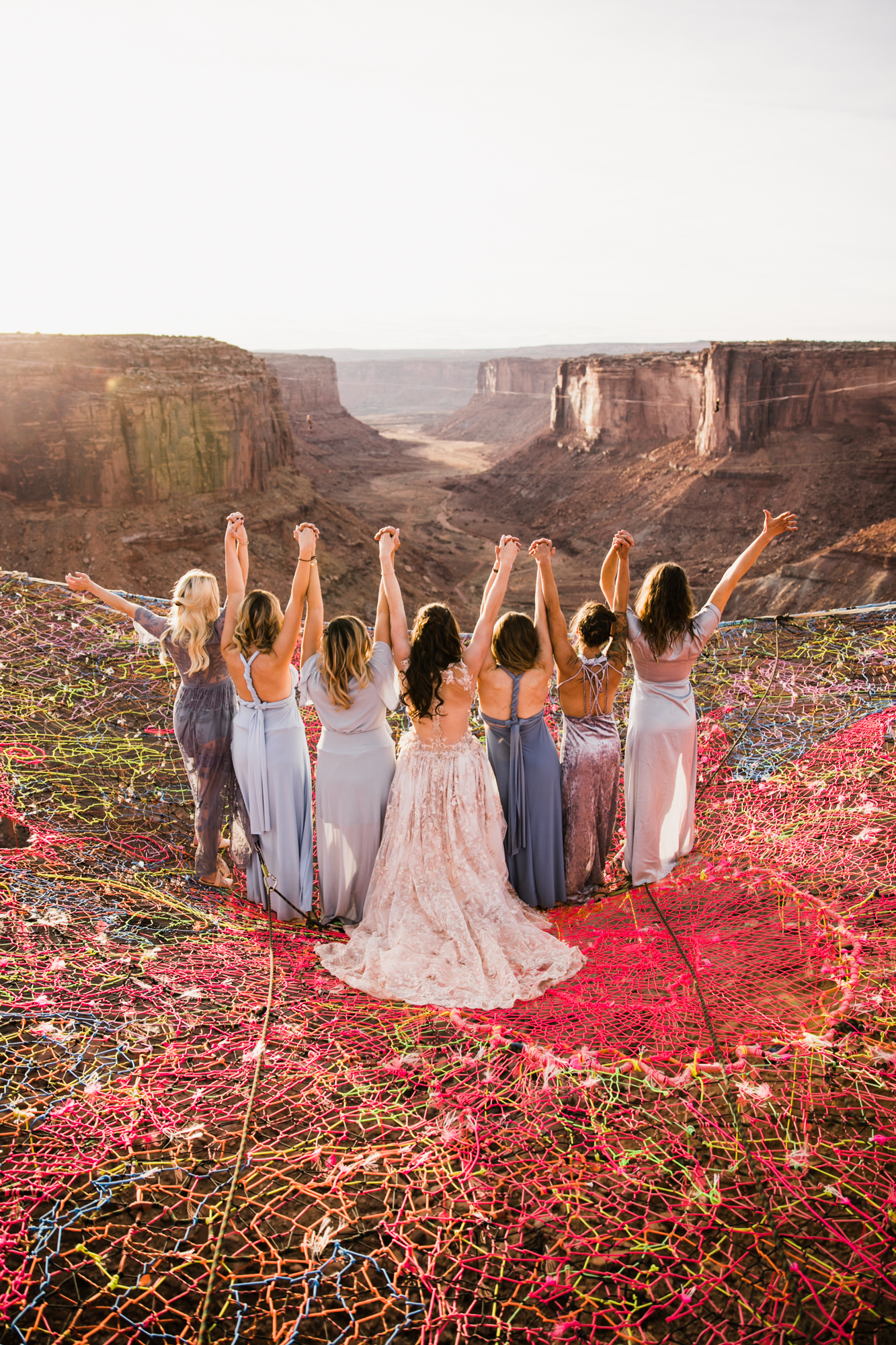 spacenet wedding 400 feet above a canyon in moab, utah | adventurous desert elopement | galia lahav bride | the hearnes adventure wedding photography | www.thehearnes.com