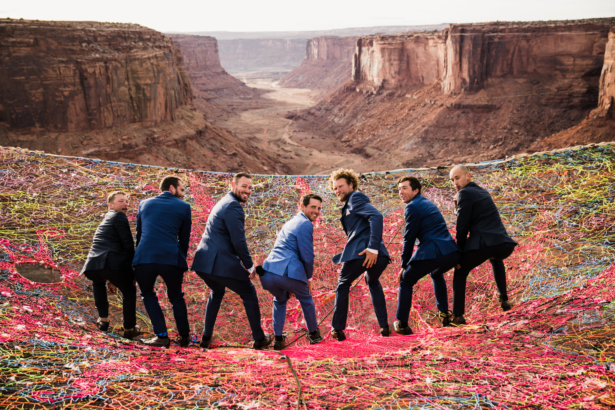 spacenet wedding 400 feet above a canyon in moab, utah | adventurous desert elopement | galia lahav bride | the hearnes adventure wedding photography | www.thehearnes.com