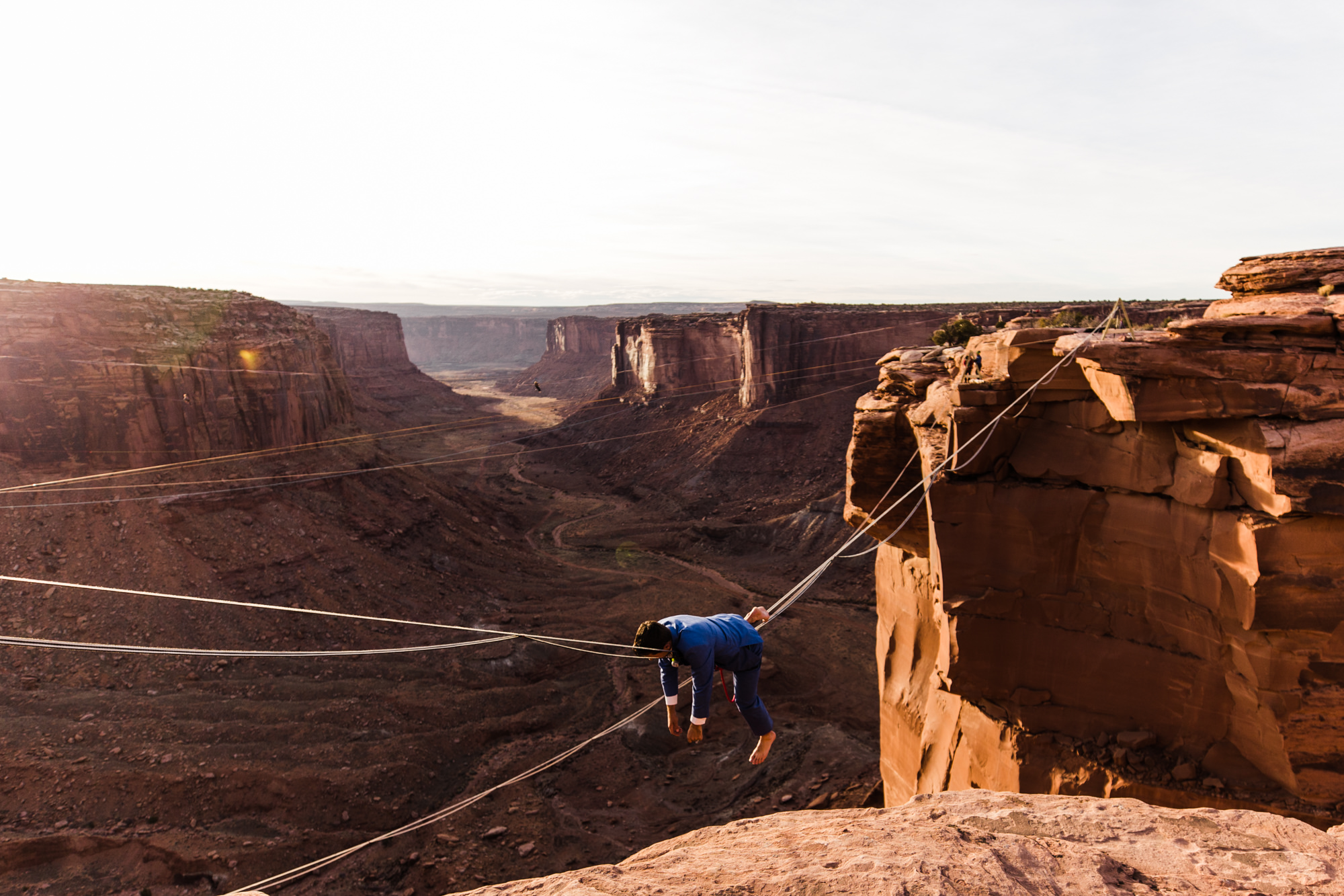 spacenet wedding 400 feet above a canyon in moab, utah | adventurous desert elopement | galia lahav bride | the hearnes adventure wedding photography | www.thehearnes.com