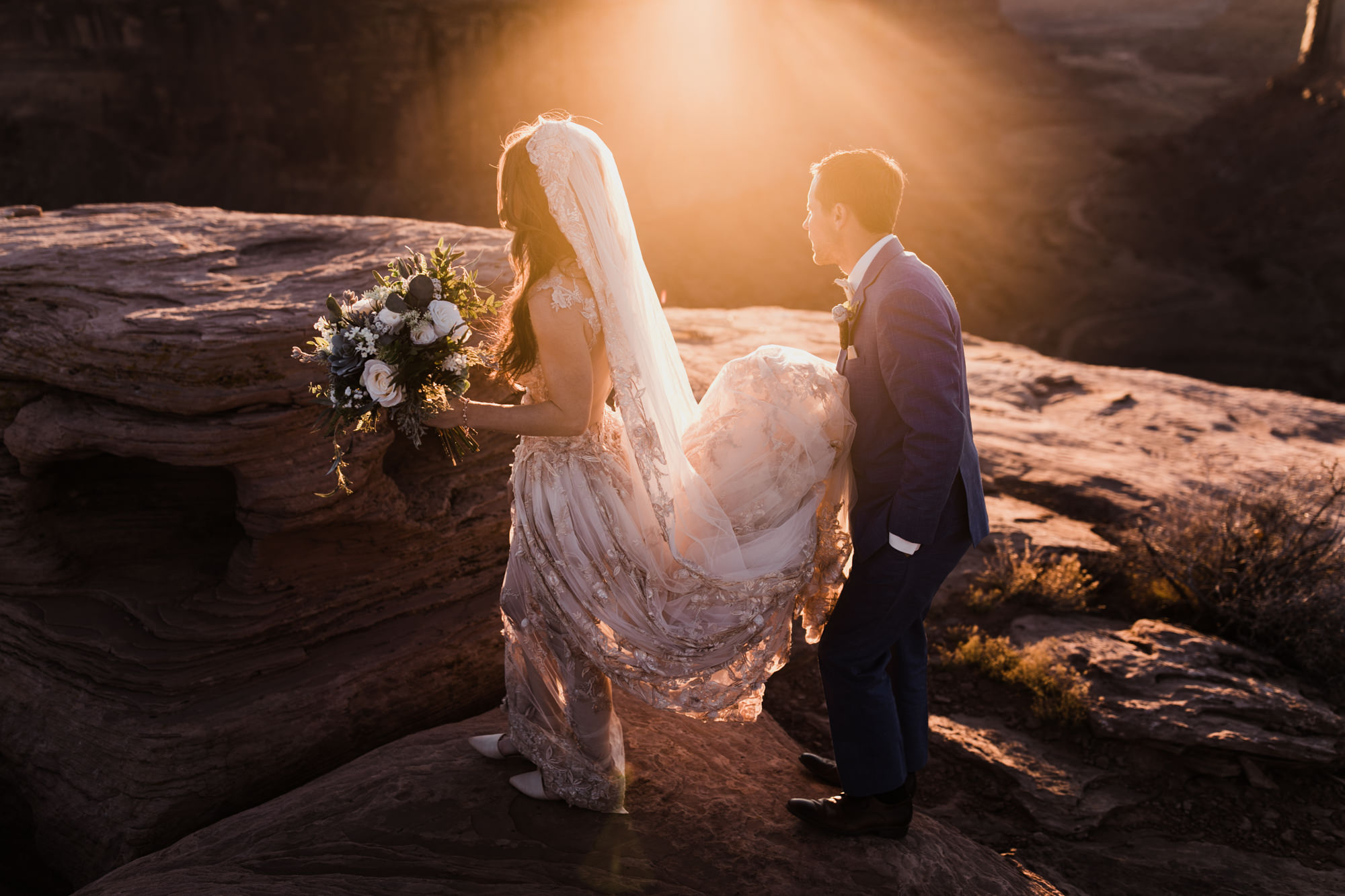 spacenet wedding 400 feet above a canyon in moab, utah | adventurous desert elopement | galia lahav bride | the hearnes adventure wedding photography | www.thehearnes.com