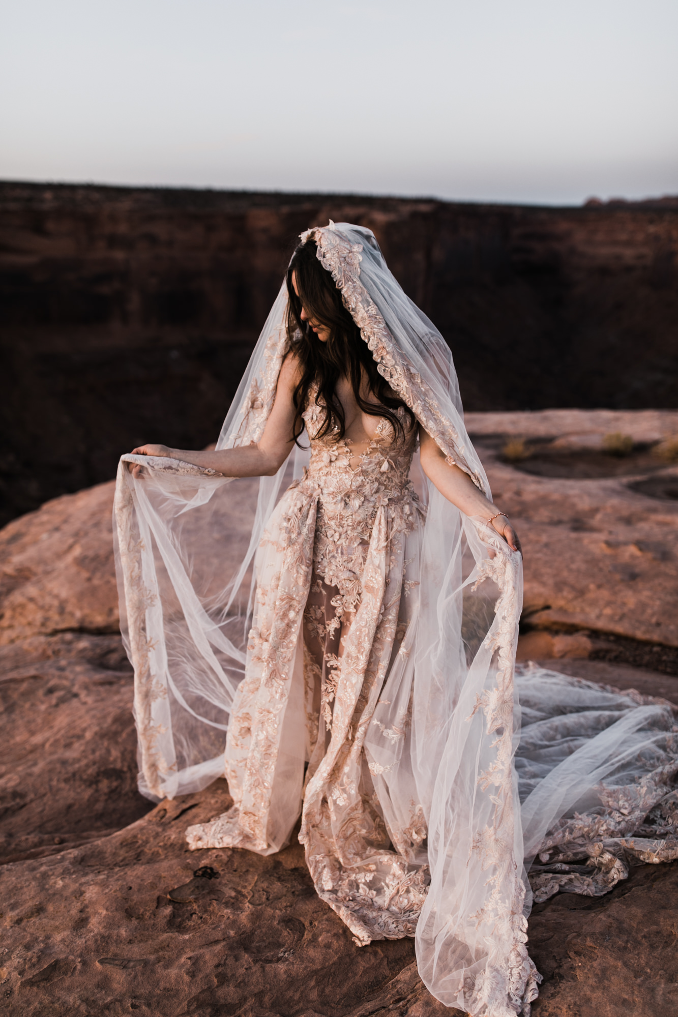 spacenet wedding 400 feet above a canyon in moab, utah | adventurous desert elopement | galia lahav bride | the hearnes adventure wedding photography | www.thehearnes.com