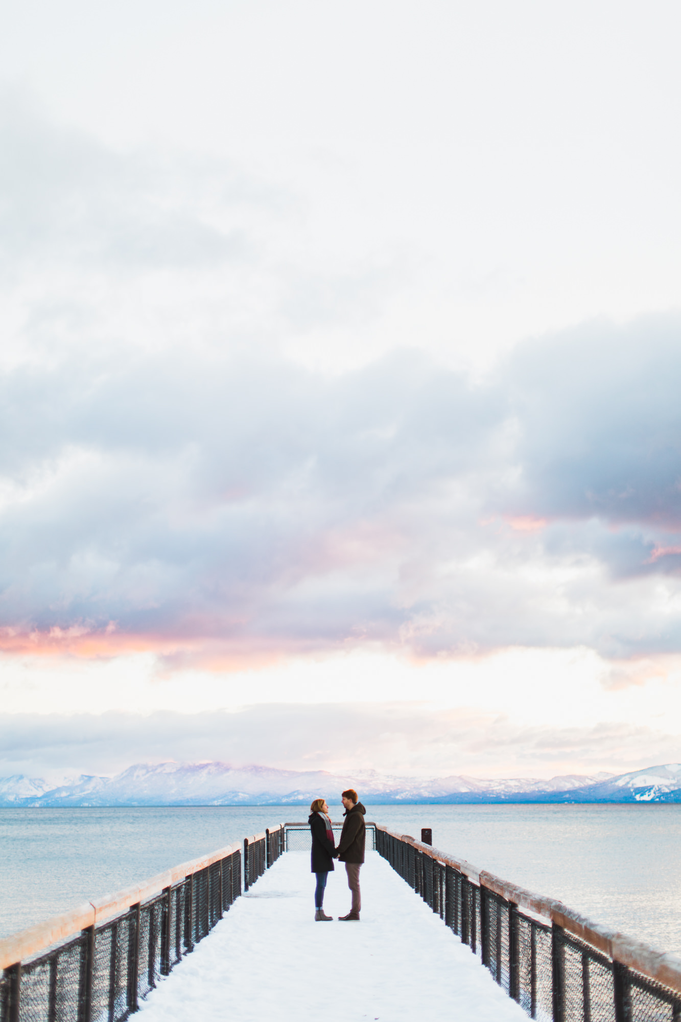 snowy engagement session on lake tahoe | destination engagement photo inspiration | utah adventure elopement photographers | the hearnes adventure photography | www.thehearnes.com