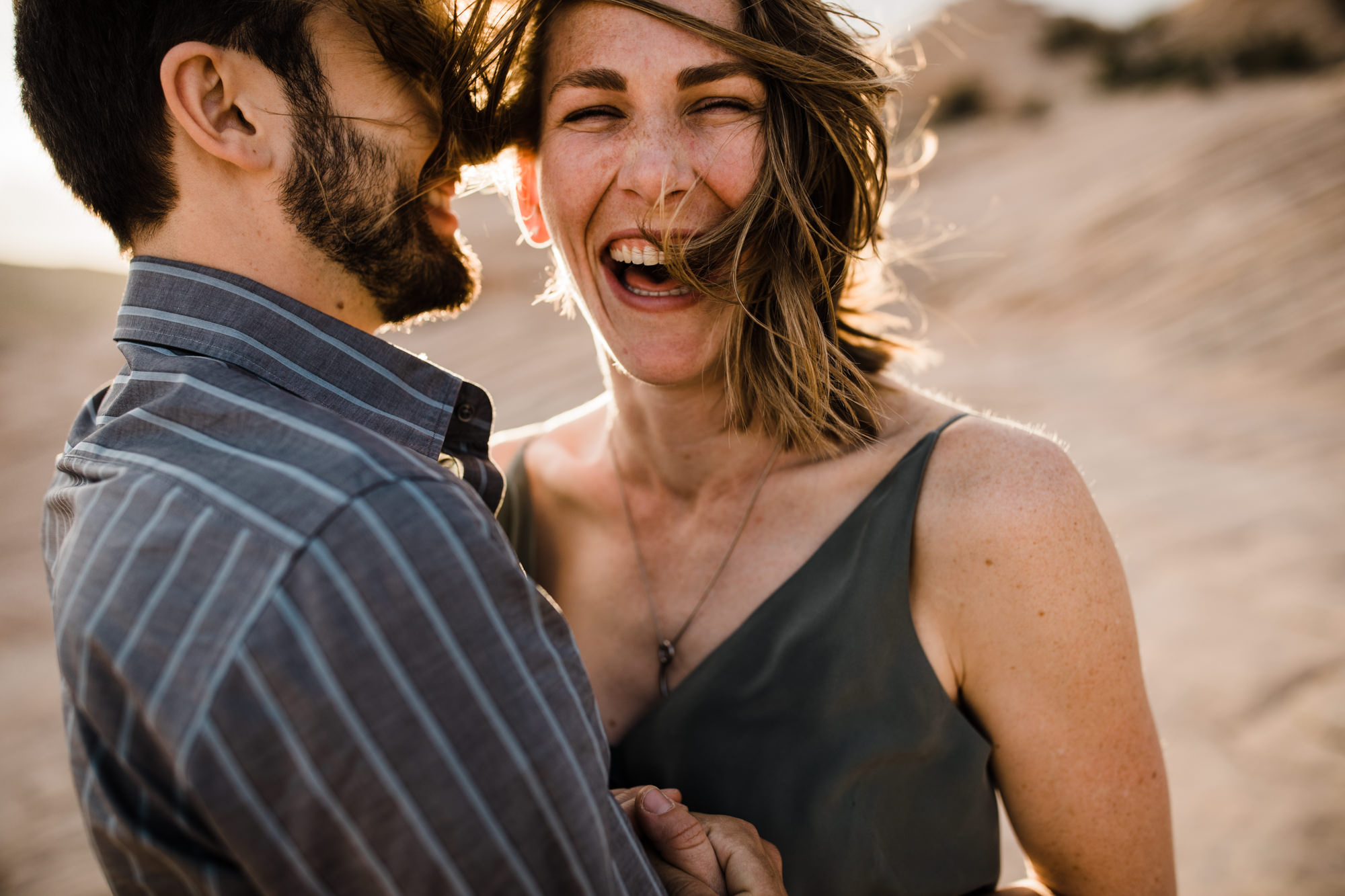 windy utah desert engagement session | destination engagement photo inspiration | utah adventure elopement photographers | the hearnes adventure photography | www.thehearnes.com