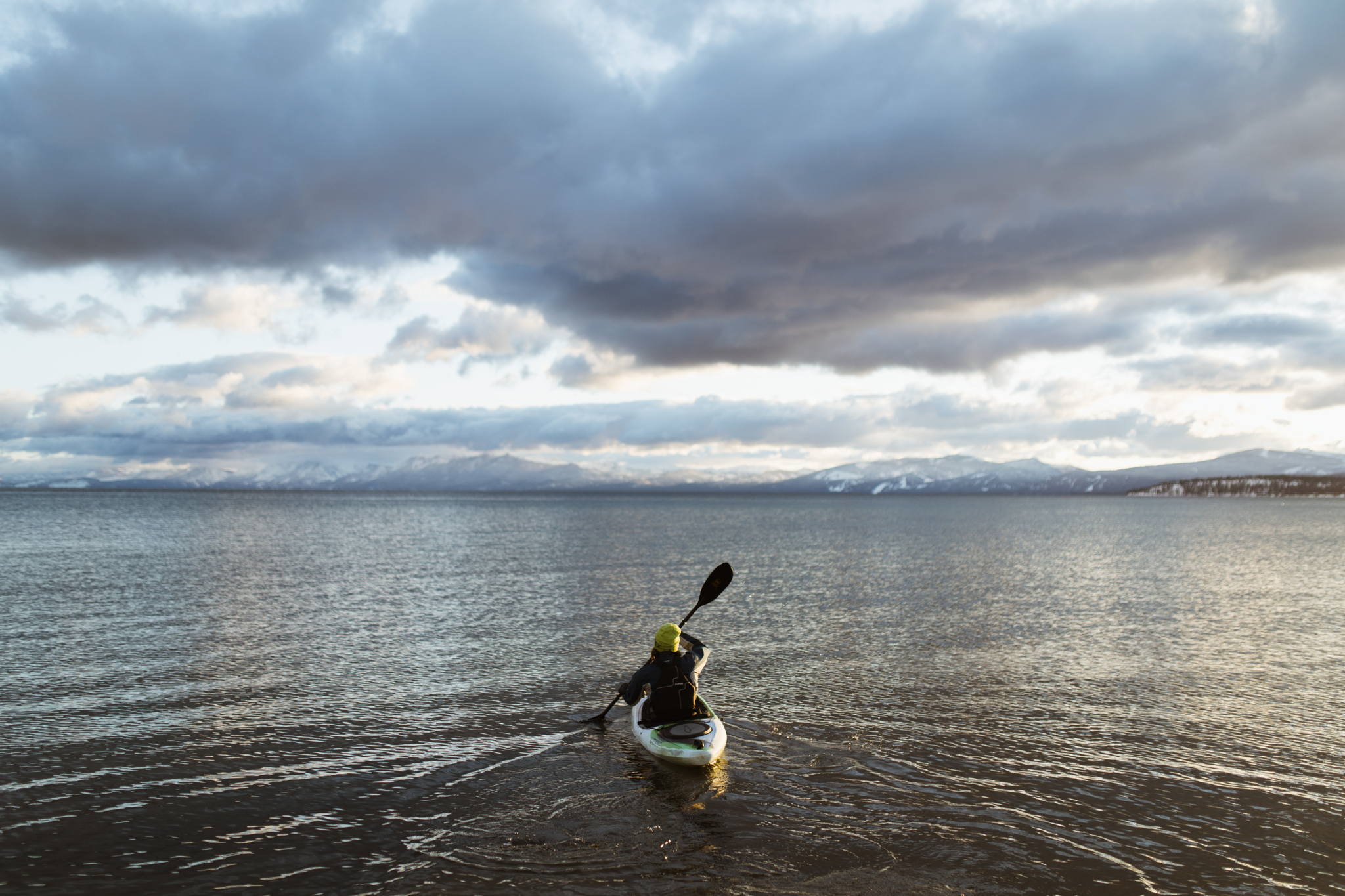 kayaking on lake tahoe in the snow | utah and california adventure elopement photographers | the hearnes adventure photography | www.thehearnes.com