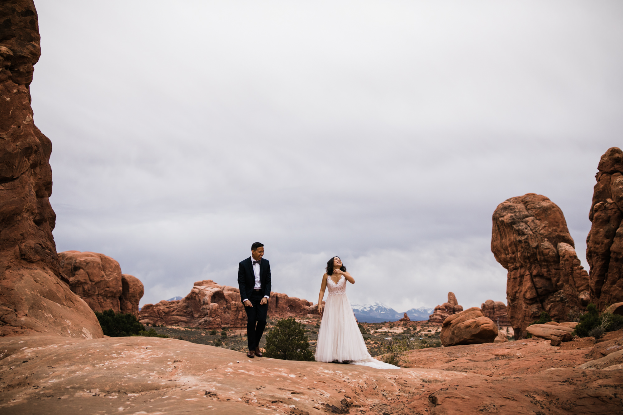 elopement first look in arches national park | desert elopement | moab wedding photographer | the hearnes adventure photography | www.thehearnes.com