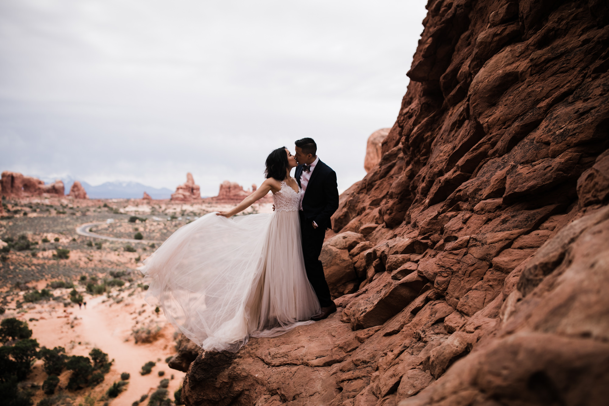 elopement first look in arches national park | desert elopement | moab wedding photographer | the hearnes adventure photography | www.thehearnes.com