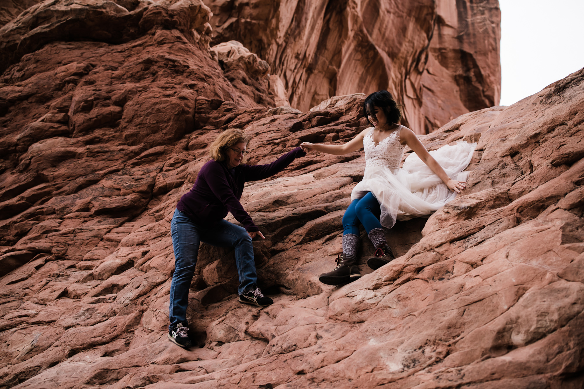 elopement first look in arches national park | desert elopement | moab wedding photographer | the hearnes adventure photography | www.thehearnes.com
