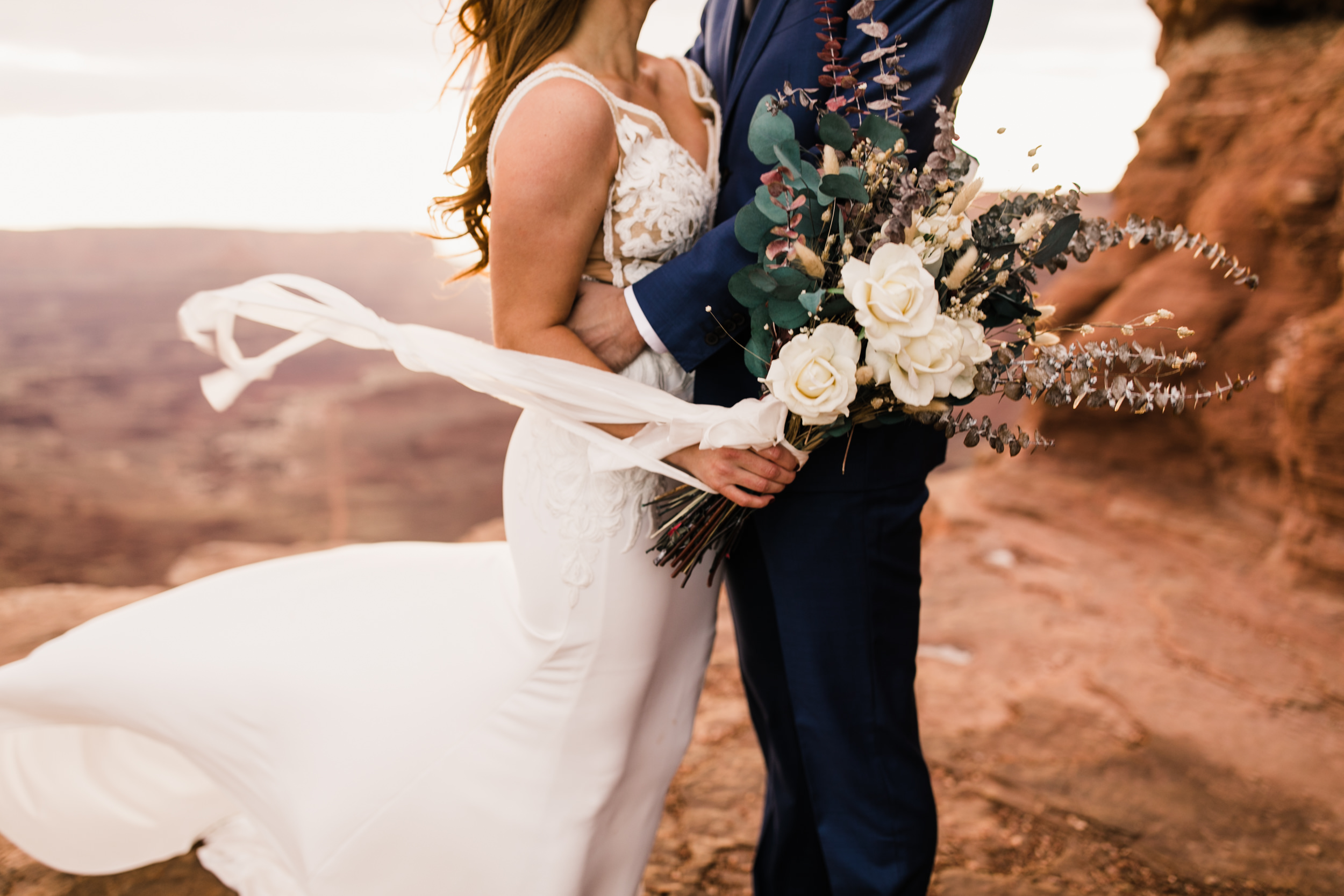 ben + rachelle's elopement in a secret canyon near Moab, Utah | canyonlands national park first look + portraits | secret ceremony on the edge of a cliff | moab adventure wedding photographer