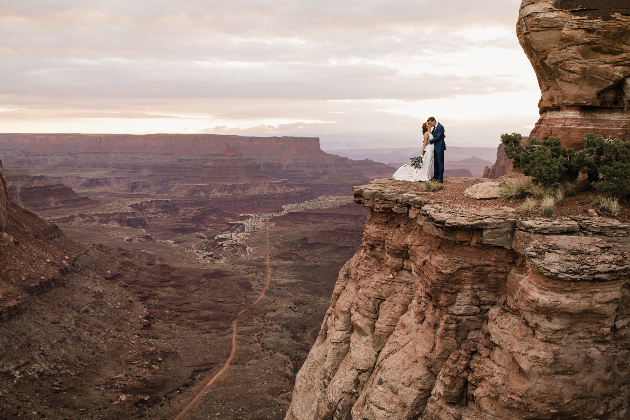 ben + rachelle's elopement in a secret canyon near Moab, Utah | canyonlands national park first look + portraits | secret ceremony on the edge of a cliff | moab adventure wedding photographer