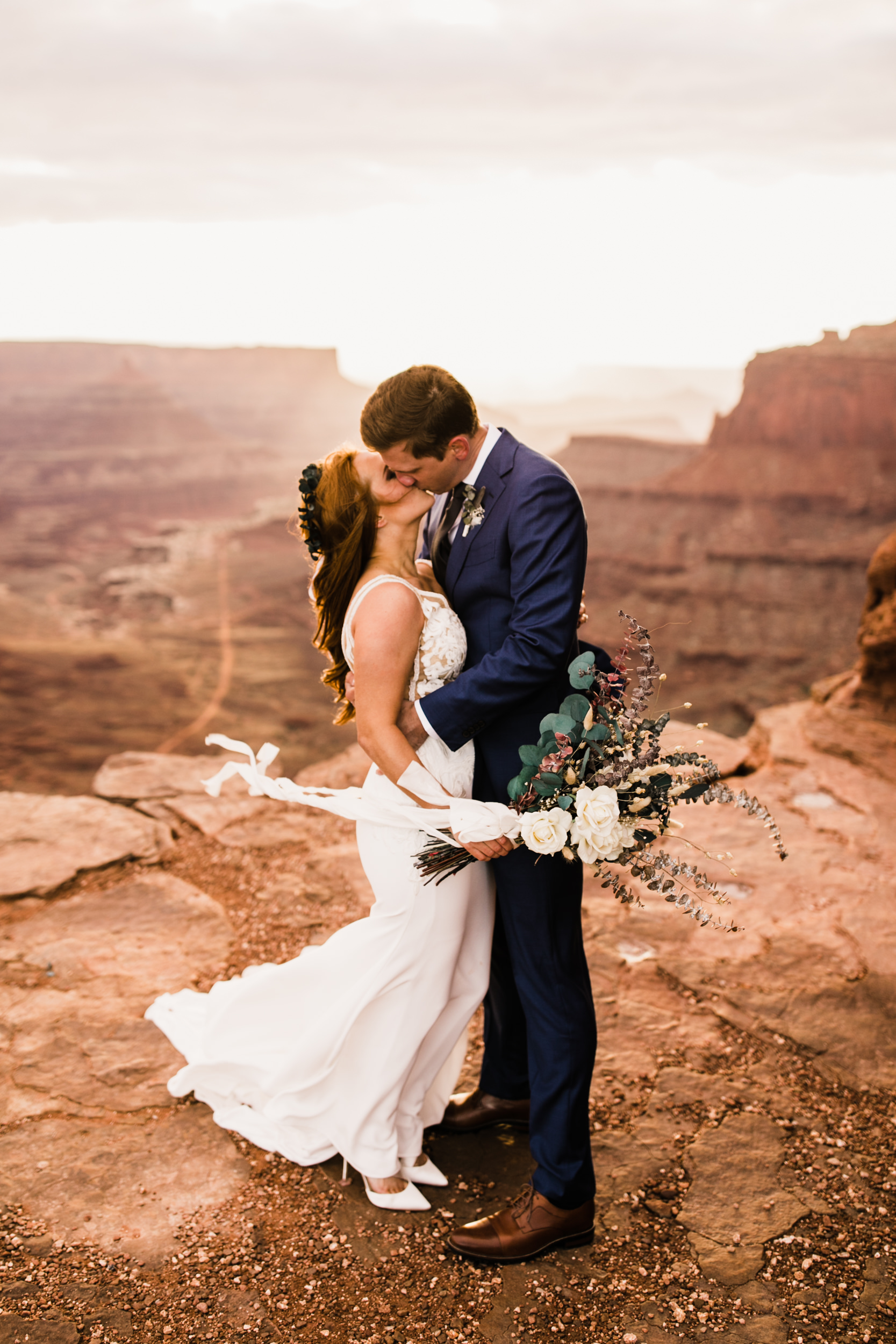 ben + rachelle's elopement in a secret canyon near Moab, Utah | canyonlands national park first look + portraits | secret ceremony on the edge of a cliff | moab adventure wedding photographer