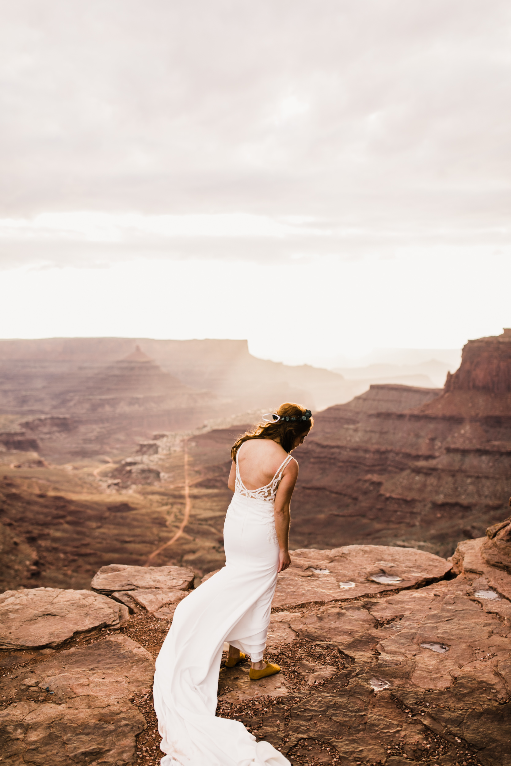 ben + rachelle's elopement in a secret canyon near Moab, Utah | canyonlands national park first look + portraits | secret ceremony on the edge of a cliff | moab adventure wedding photographer