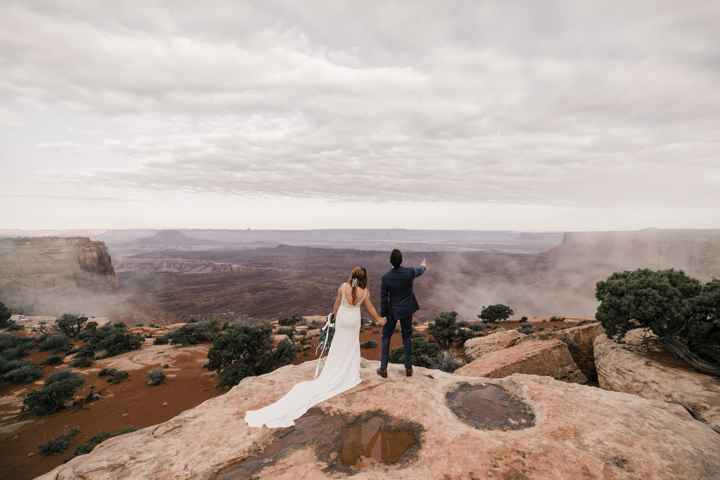 ben + rachelle's elopement in a secret canyon near Moab, Utah | canyonlands national park first look + portraits | secret ceremony on the edge of a cliff | moab adventure wedding photographer