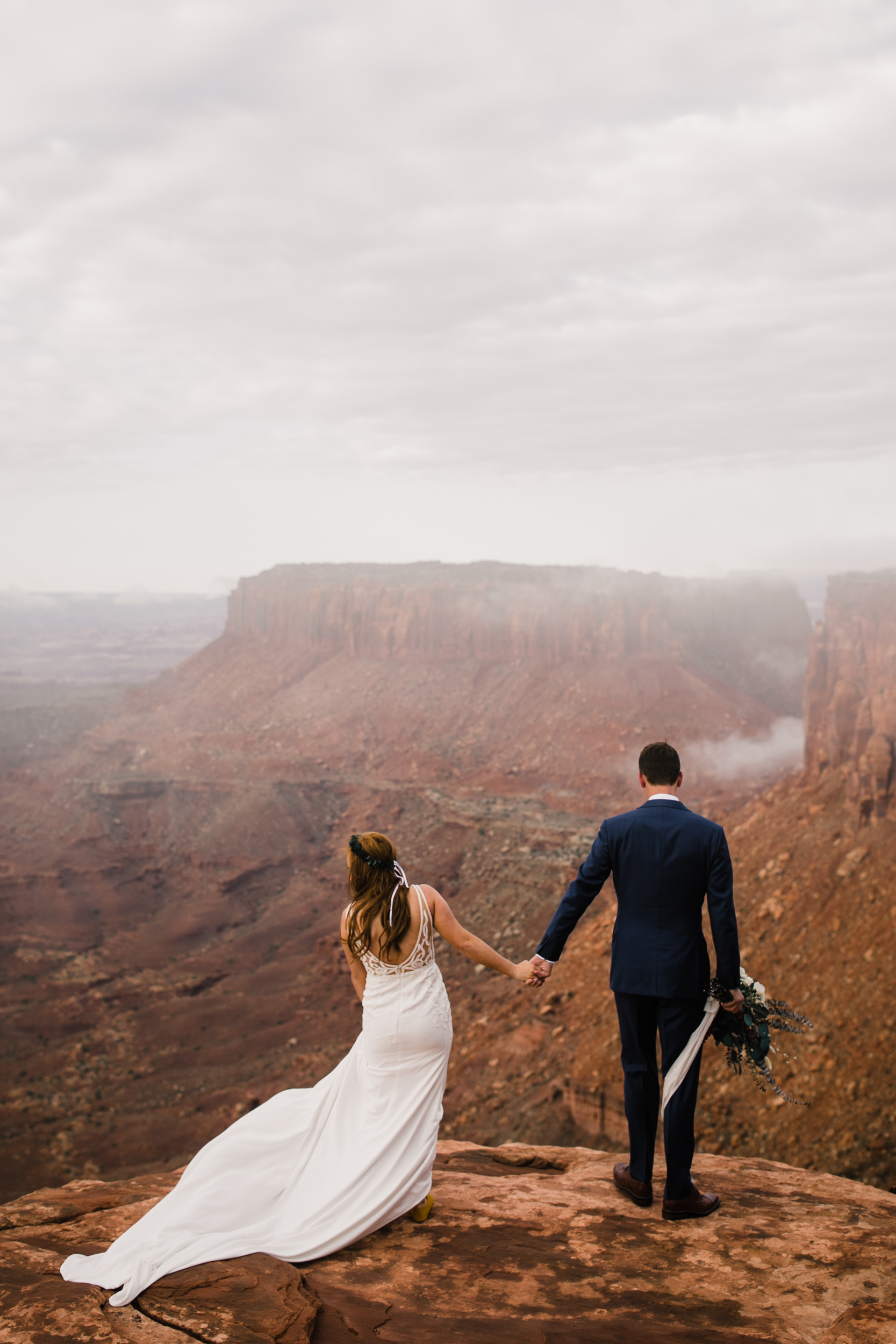 ben + rachelle's elopement in a secret canyon near Moab, Utah | canyonlands national park first look + portraits | secret ceremony on the edge of a cliff | moab adventure wedding photographer