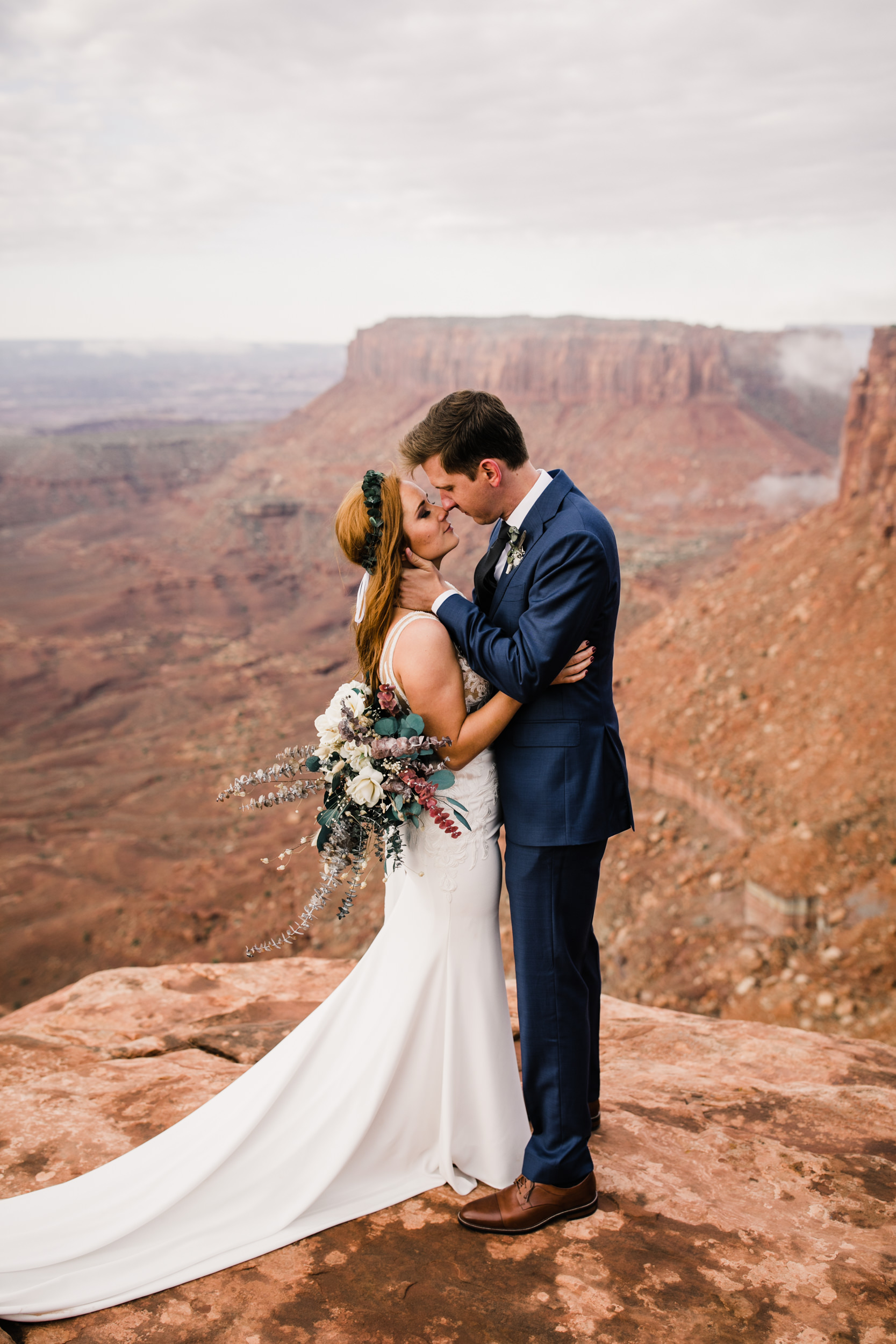 ben + rachelle's elopement in a secret canyon near Moab, Utah | canyonlands national park first look + portraits | secret ceremony on the edge of a cliff | moab adventure wedding photographer