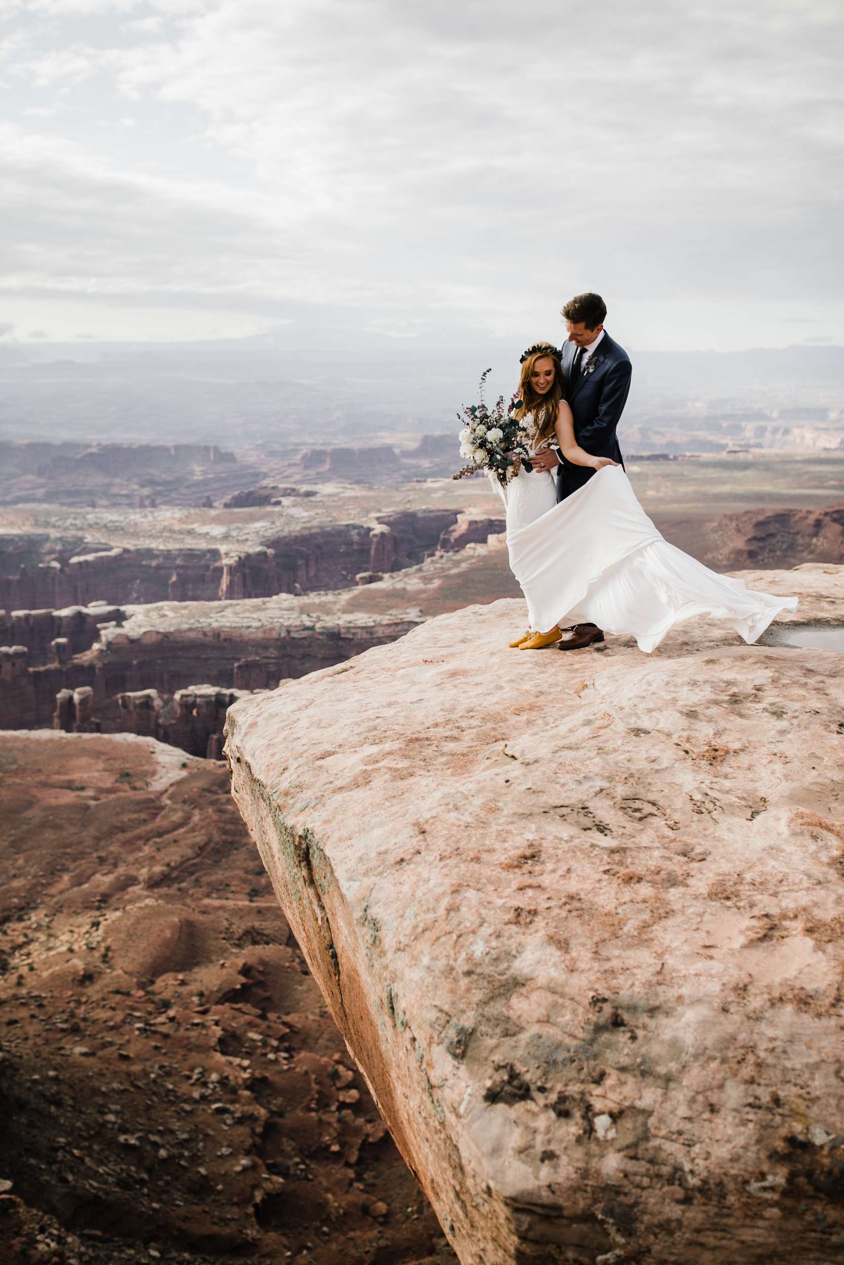 ben + rachelle's elopement in a secret canyon near Moab, Utah | canyonlands national park first look + portraits | secret ceremony on the edge of a cliff | moab adventure wedding photographer