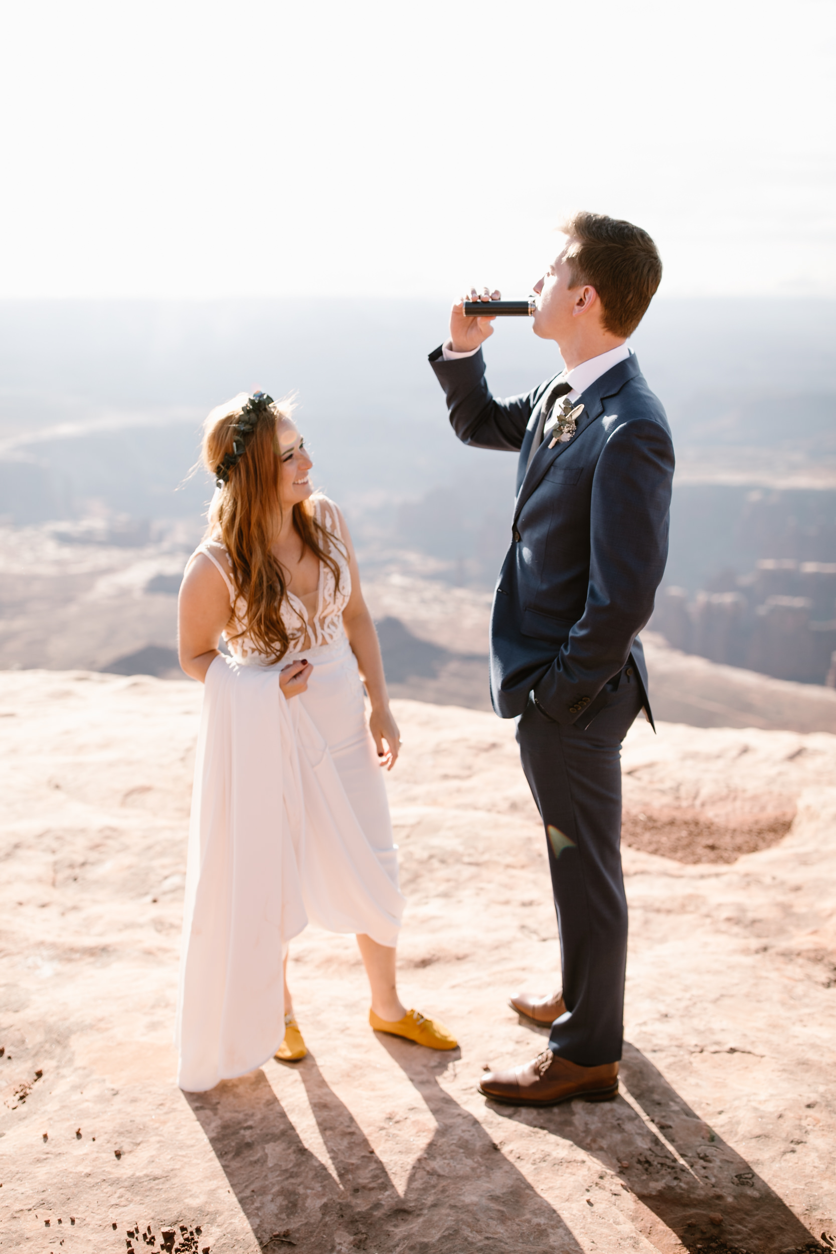 ben + rachelle's elopement in a secret canyon near Moab, Utah | canyonlands national park first look + portraits | secret ceremony on the edge of a cliff | moab adventure wedding photographer