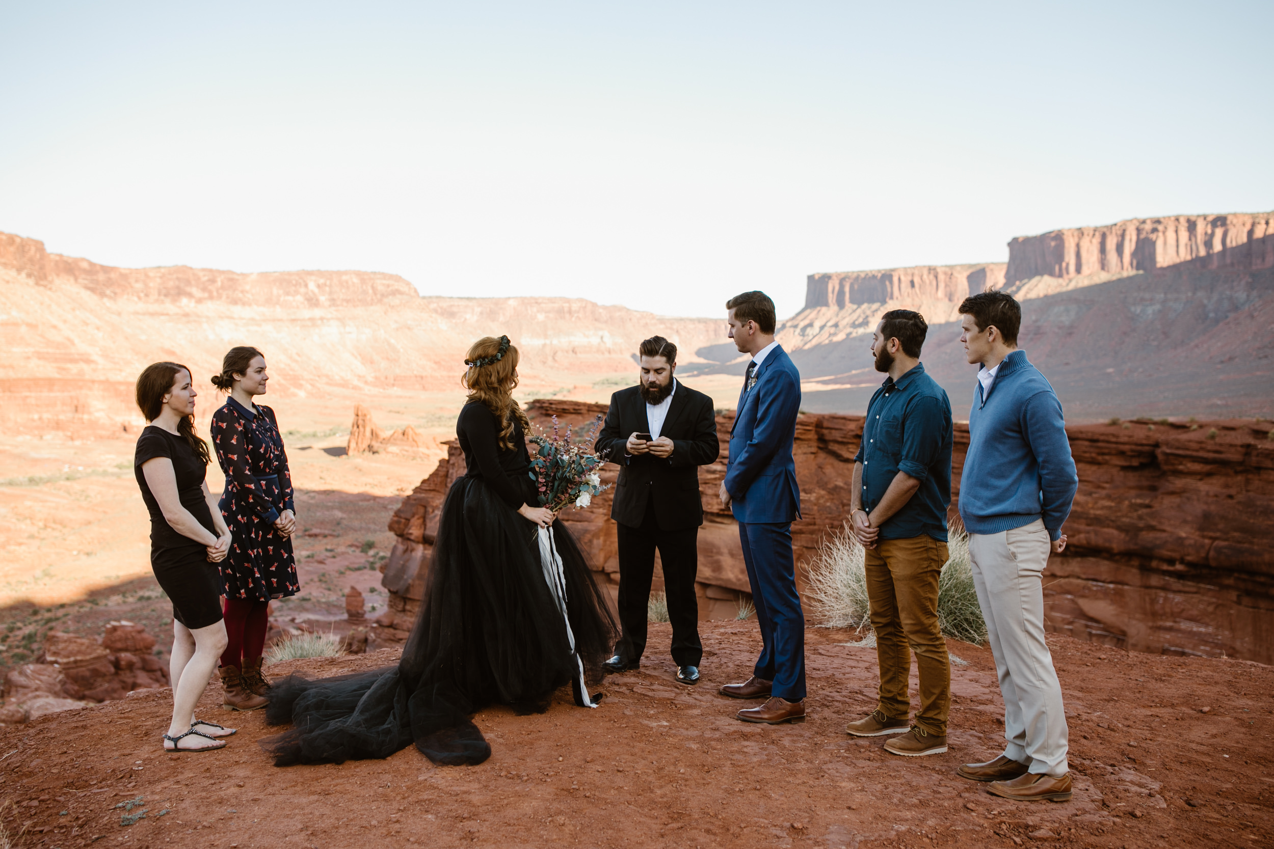 ben + rachelle's elopement in a secret canyon near Moab, Utah | canyonlands national park first look + portraits | secret ceremony on the edge of a cliff | moab adventure wedding photographer