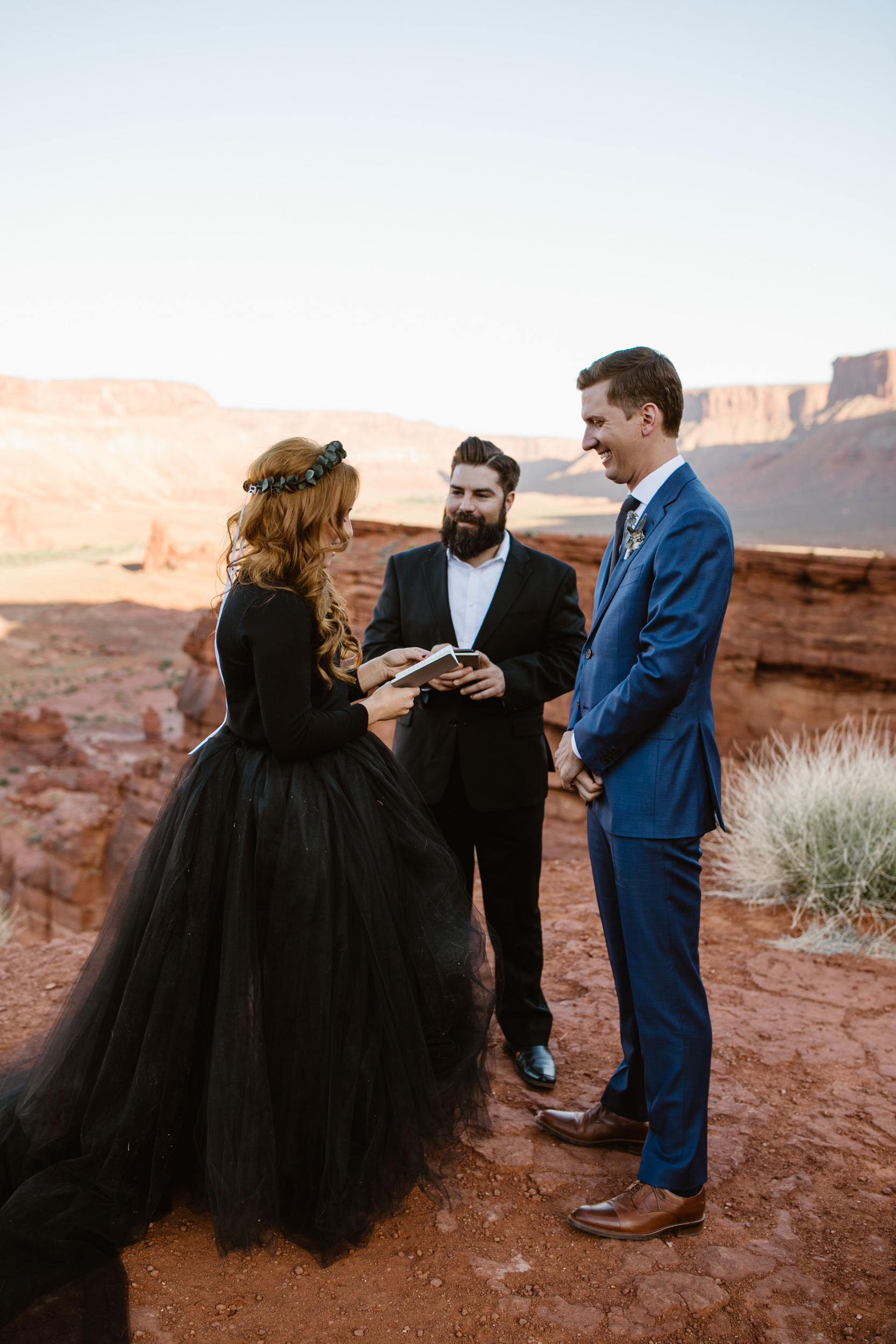 ben + rachelle's elopement in a secret canyon near Moab, Utah | canyonlands national park first look + portraits | secret ceremony on the edge of a cliff | moab adventure wedding photographer