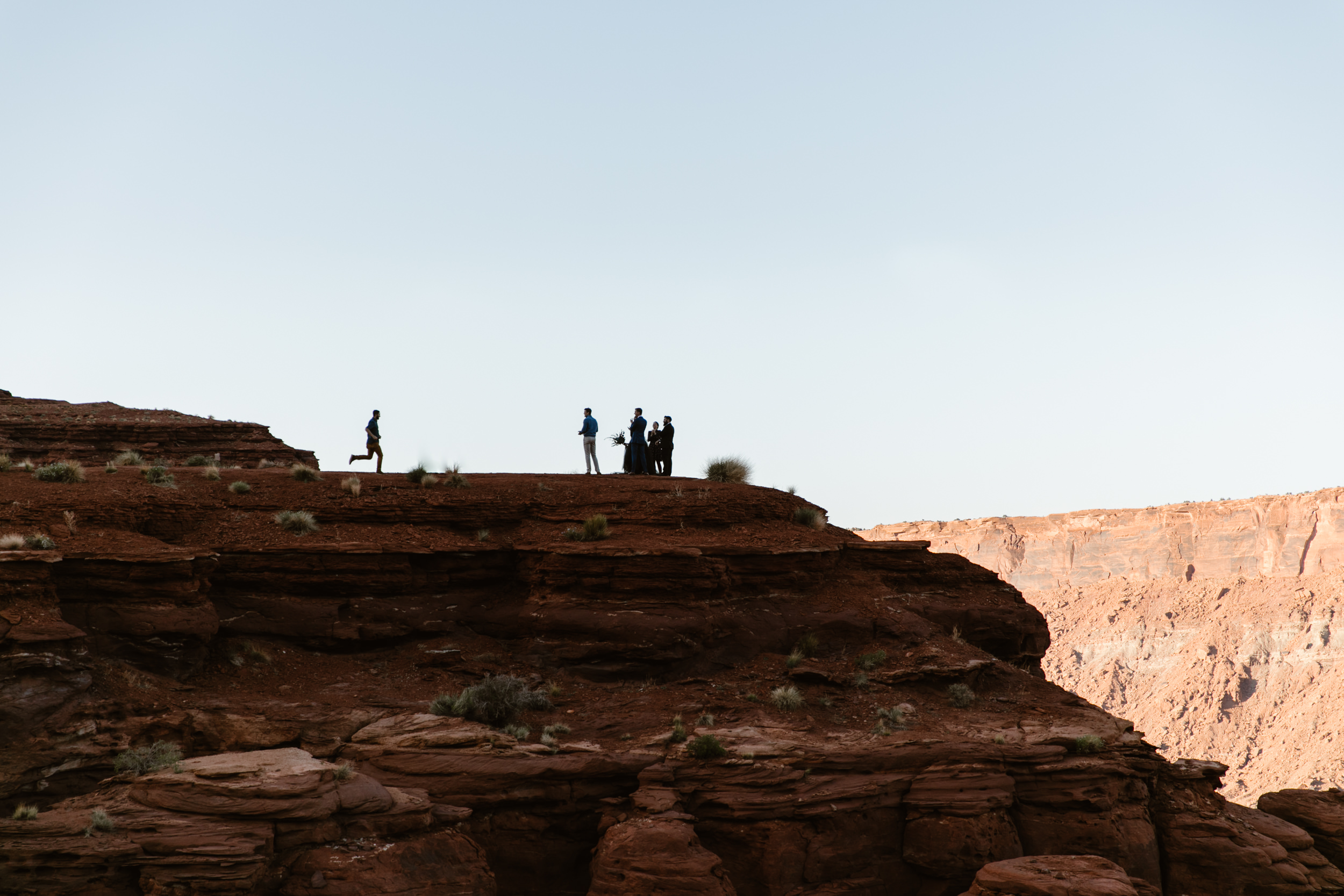 ben + rachelle's elopement in a secret canyon near Moab, Utah | canyonlands national park first look + portraits | secret ceremony on the edge of a cliff | moab adventure wedding photographer