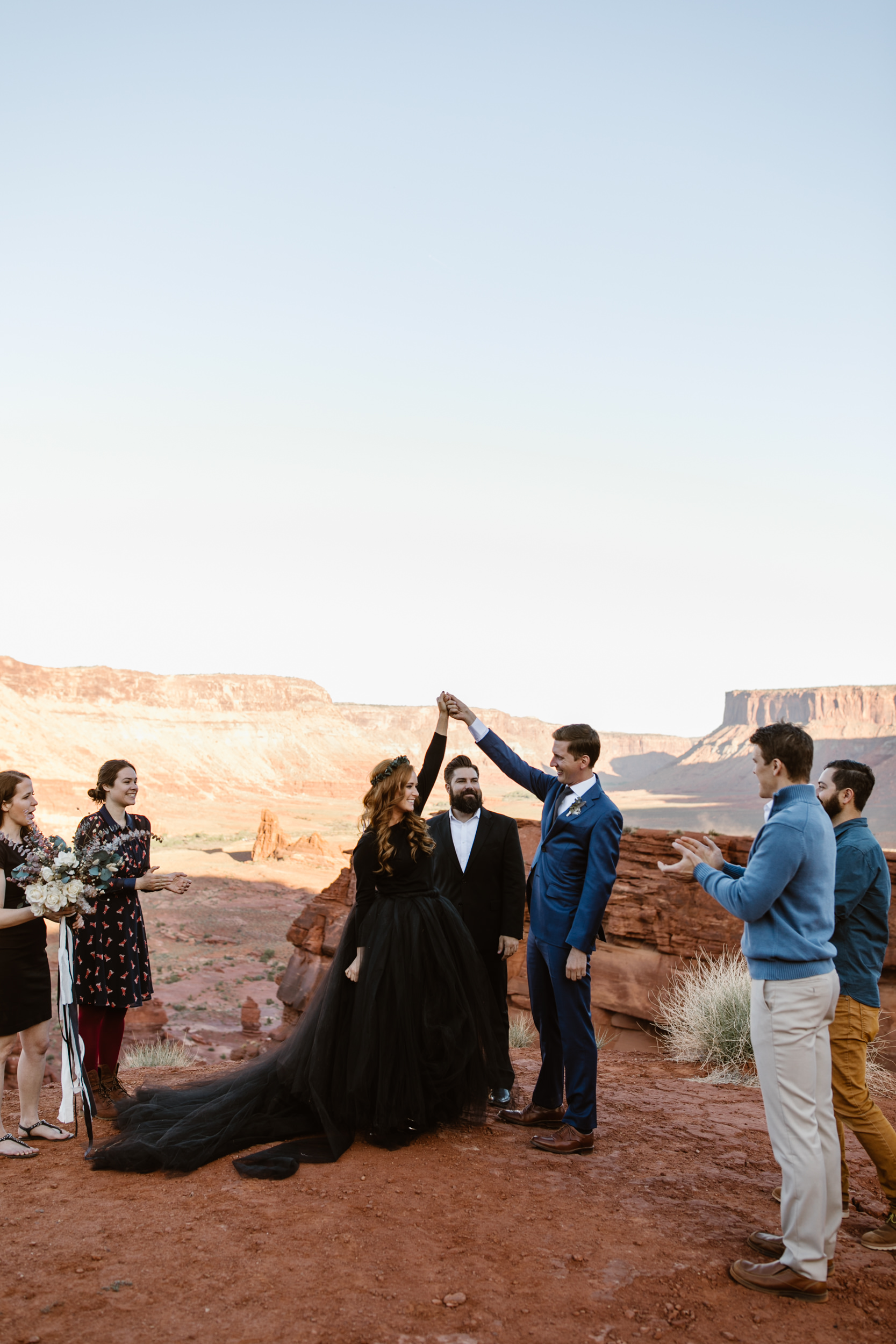 ben + rachelle's elopement in a secret canyon near Moab, Utah | canyonlands national park first look + portraits | secret ceremony on the edge of a cliff | moab adventure wedding photographer