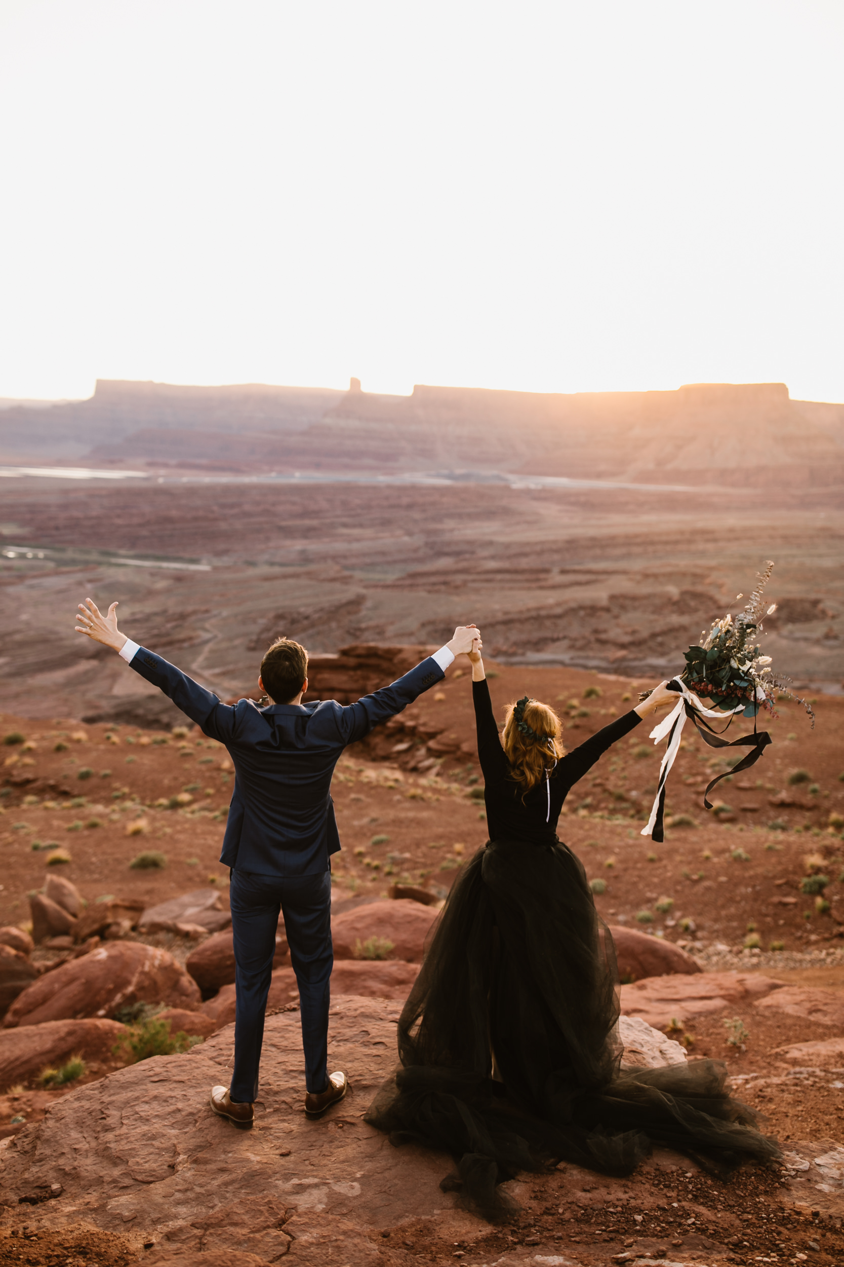 ben + rachelle's elopement in a secret canyon near Moab, Utah | canyonlands national park first look + portraits | secret ceremony on the edge of a cliff | moab adventure wedding photographer