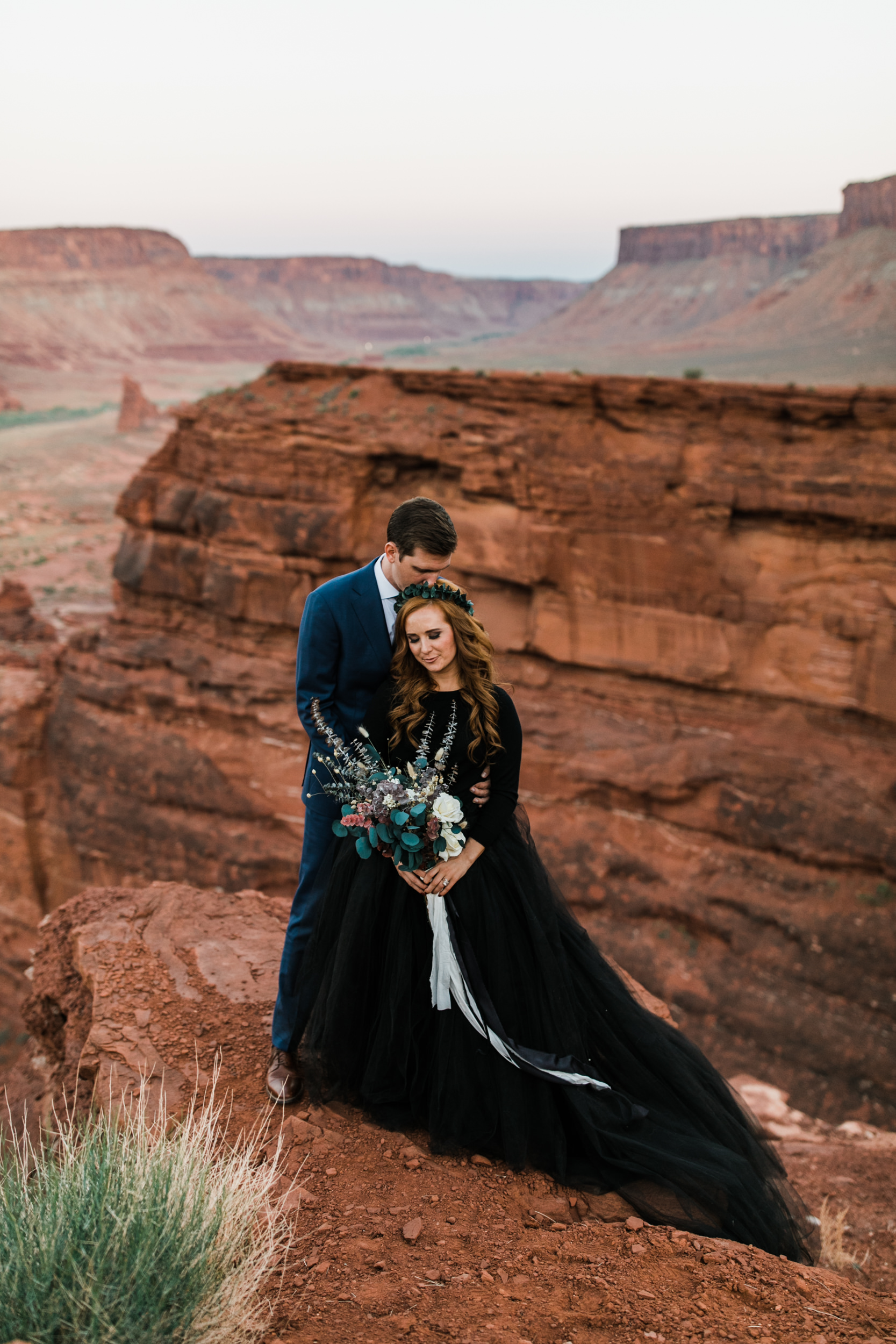 ben + rachelle's elopement in a secret canyon near Moab, Utah | canyonlands national park first look + portraits | secret ceremony on the edge of a cliff | moab adventure wedding photographer