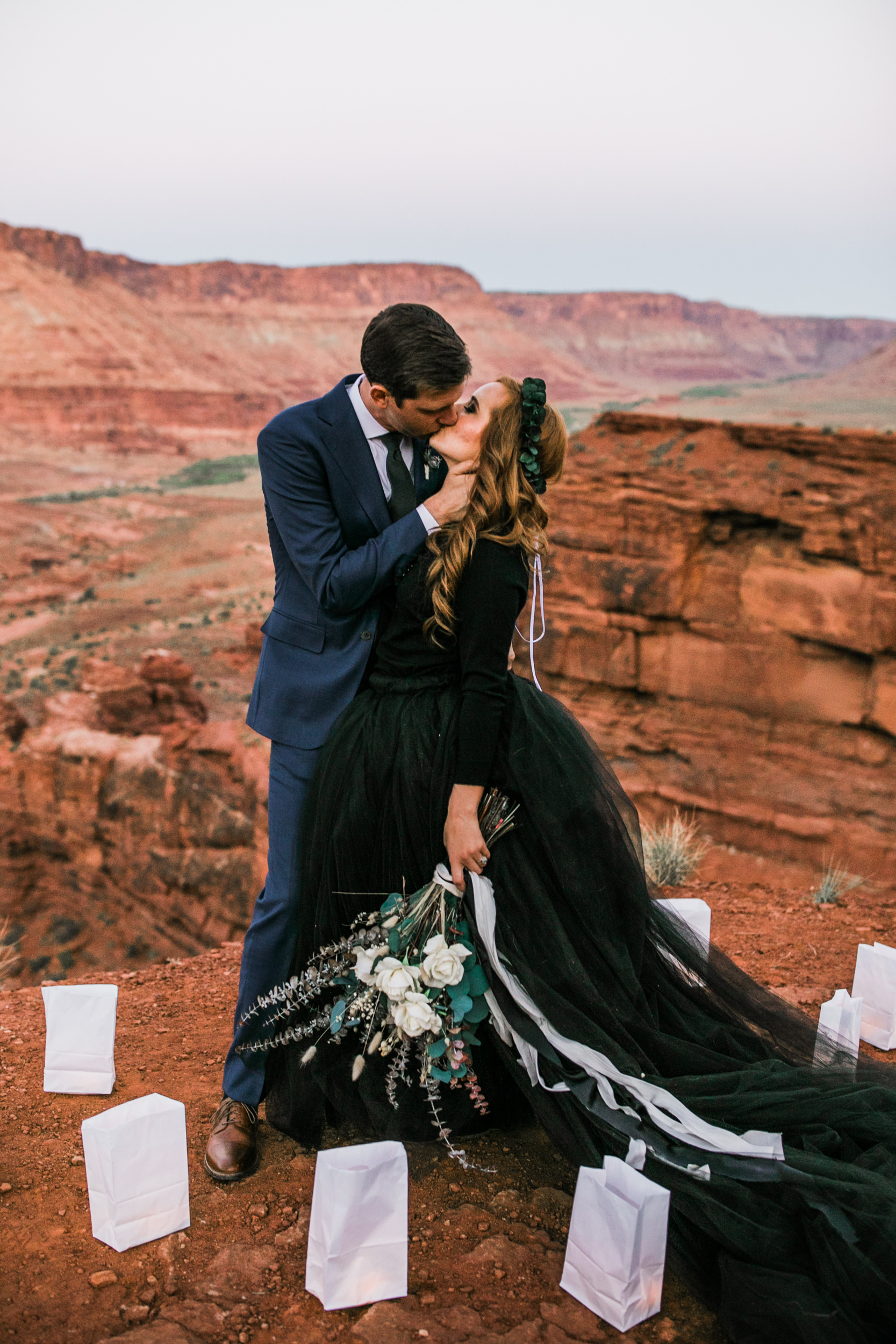 ben + rachelle's elopement in a secret canyon near Moab, Utah | canyonlands national park first look + portraits | secret ceremony on the edge of a cliff | moab adventure wedding photographer