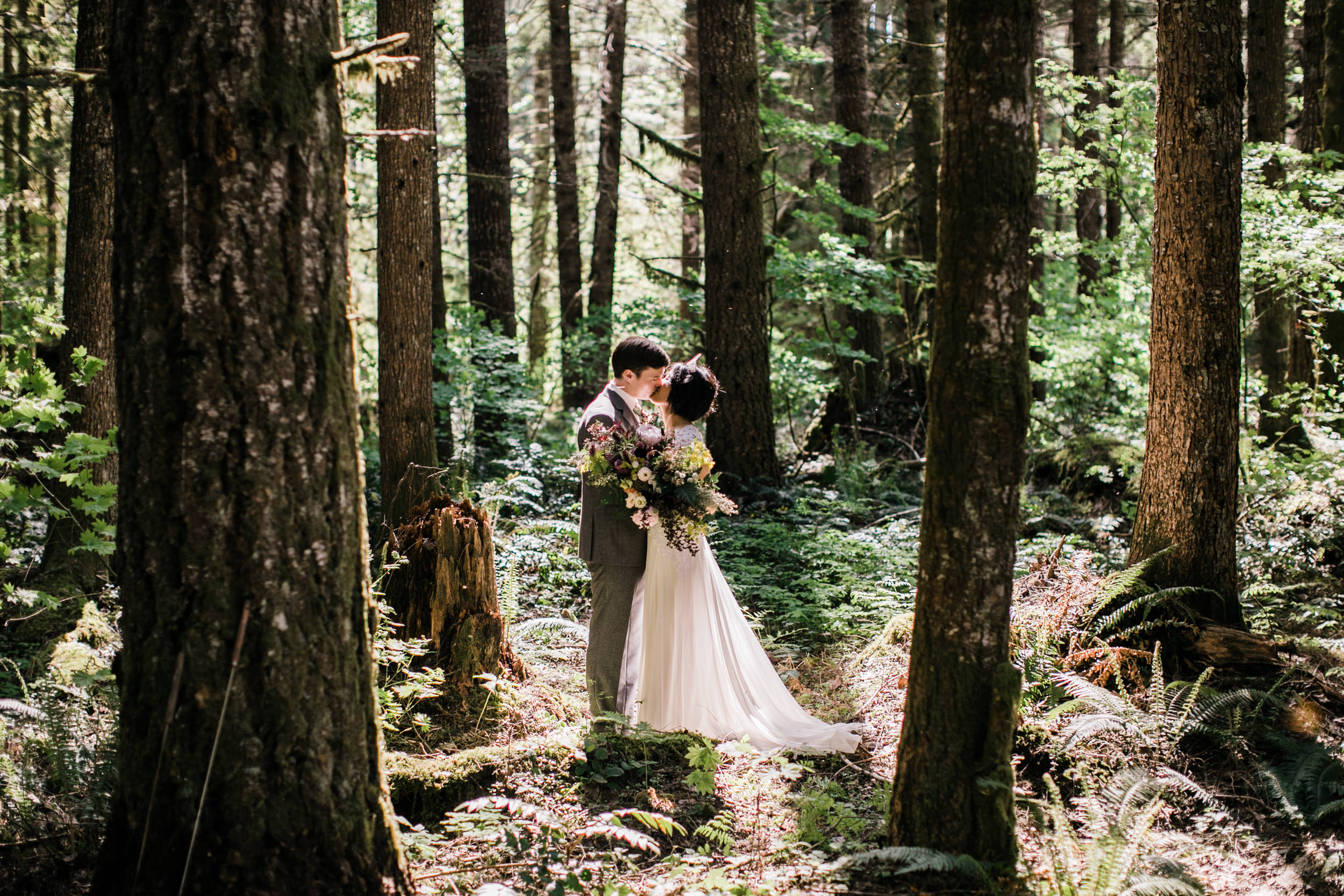 intimate wedding and reception in mount rainier national park | a frame cabin elopement first look | woodsy small reception in washington | snowy wedding portraits | elopement in the mountains