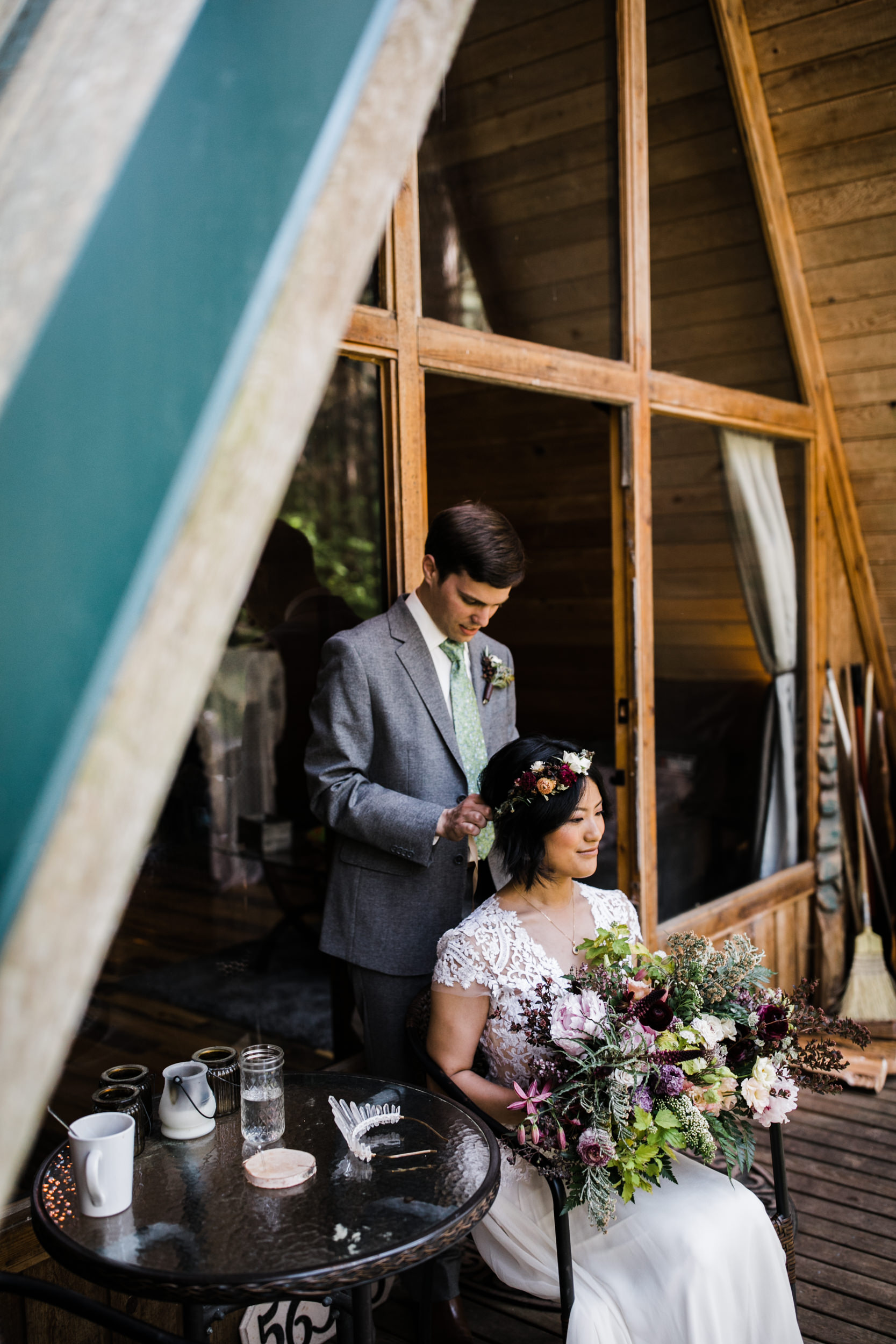 intimate wedding and reception in mount rainier national park | a frame cabin elopement first look | woodsy small reception in washington | snowy wedding portraits | elopement in the mountains