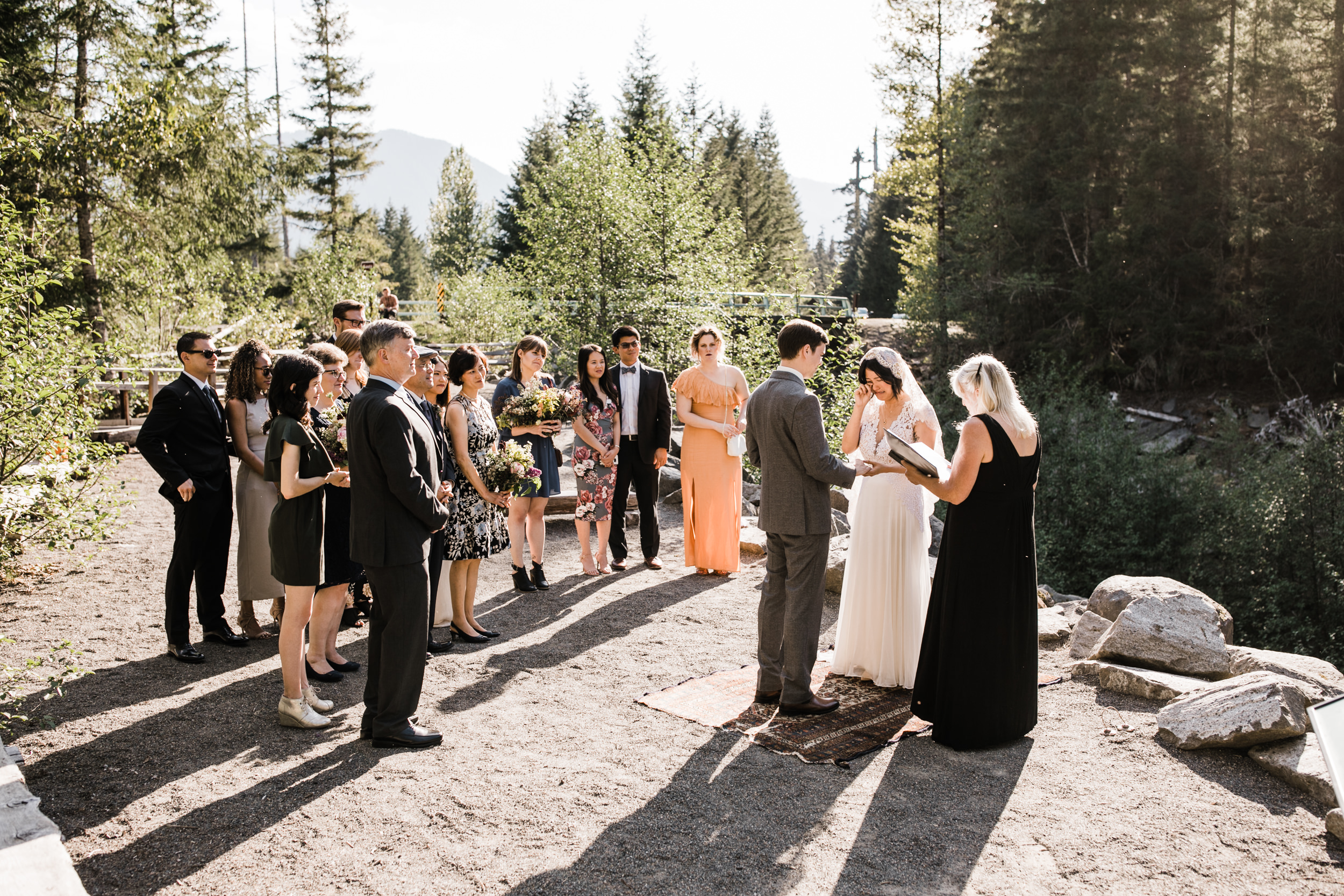 intimate wedding and reception in mount rainier national park | a frame cabin elopement first look | woodsy small reception in washington | snowy wedding portraits | elopement in the mountains