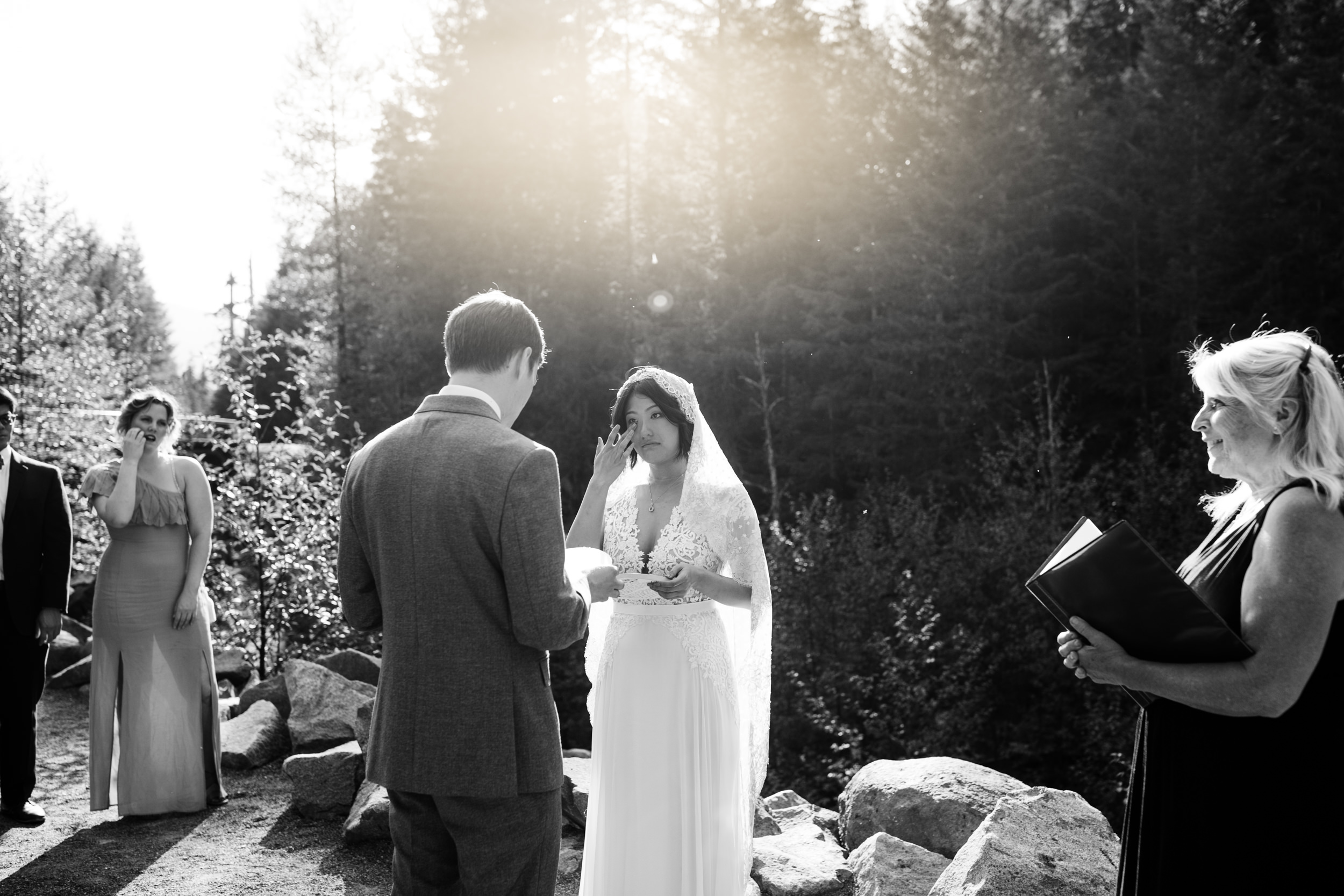 intimate wedding and reception in mount rainier national park | a frame cabin elopement first look | woodsy small reception in washington | snowy wedding portraits | elopement in the mountains