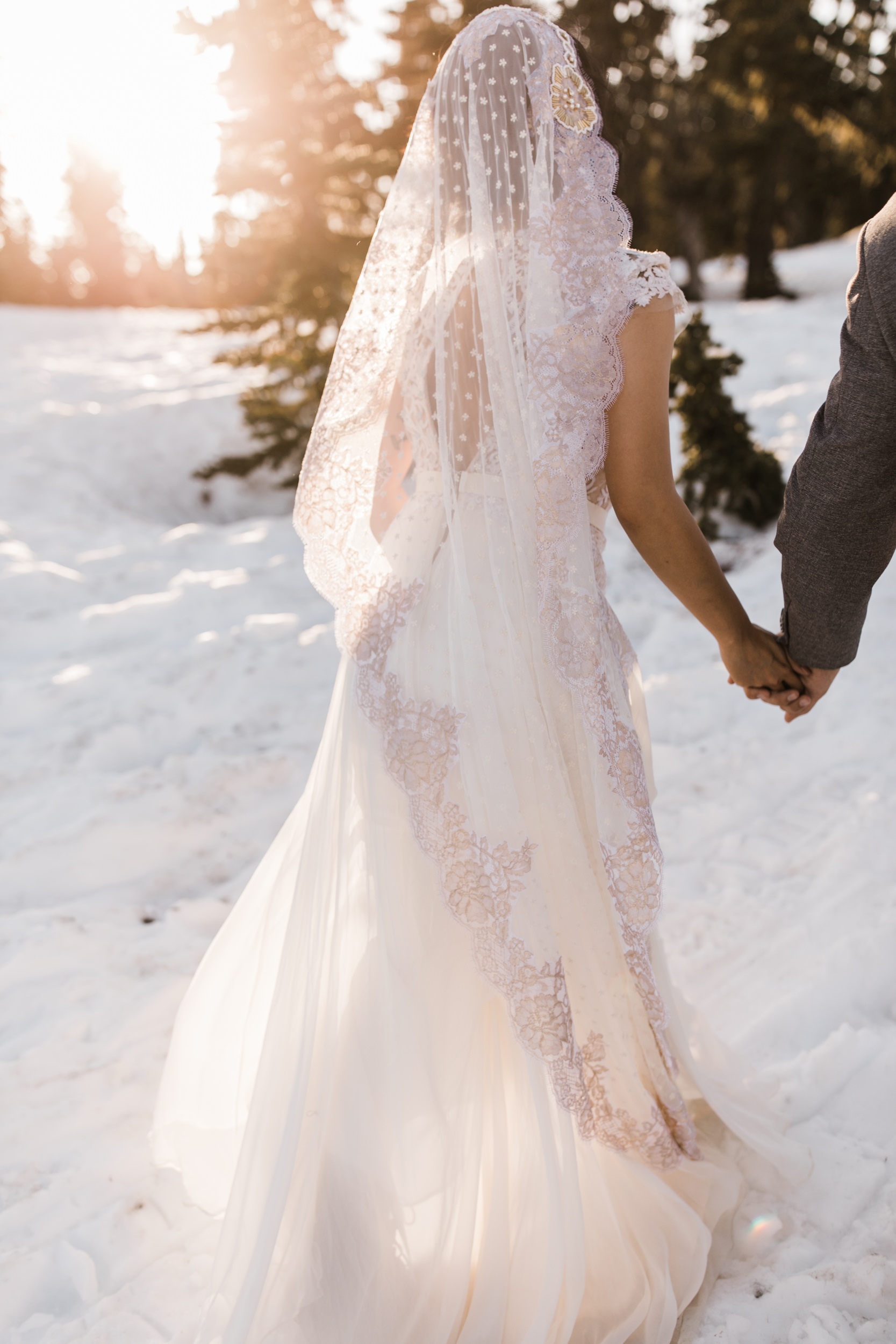 intimate wedding and reception in mount rainier national park | a frame cabin elopement first look | woodsy small reception in washington | snowy wedding portraits | elopement in the mountains