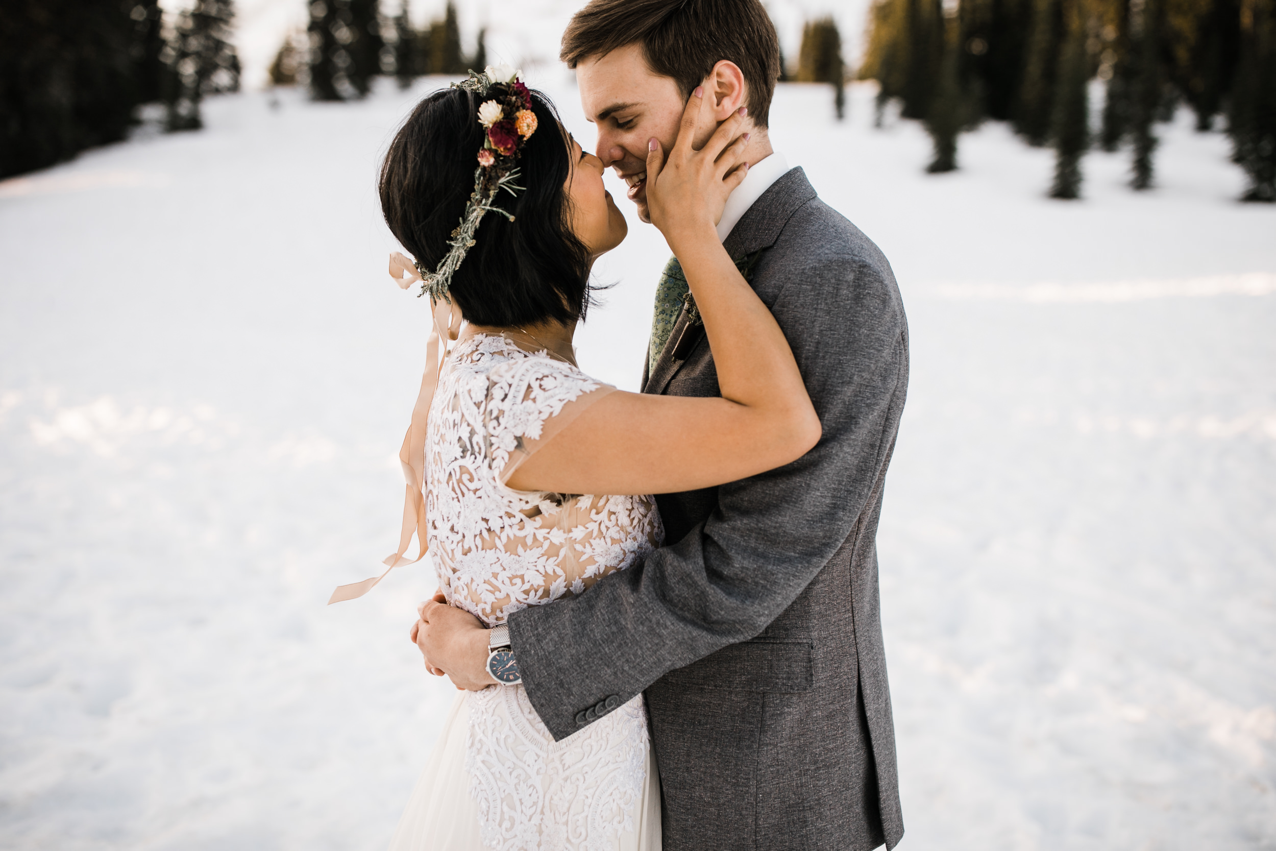 intimate wedding and reception in mount rainier national park | a frame cabin elopement first look | woodsy small reception in washington | snowy wedding portraits | elopement in the mountains